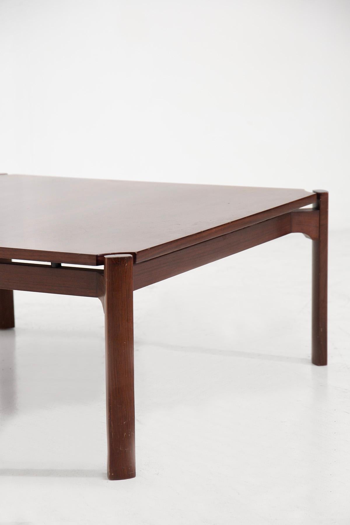 Discover the refined elegance of the 1960s with this Osvaldo Borsani wooden coffee table for Tecno, embodying the essence of mid-century modern design. This table is celebrated for its clean lines and minimalist form, showcasing Borsani's mastery in