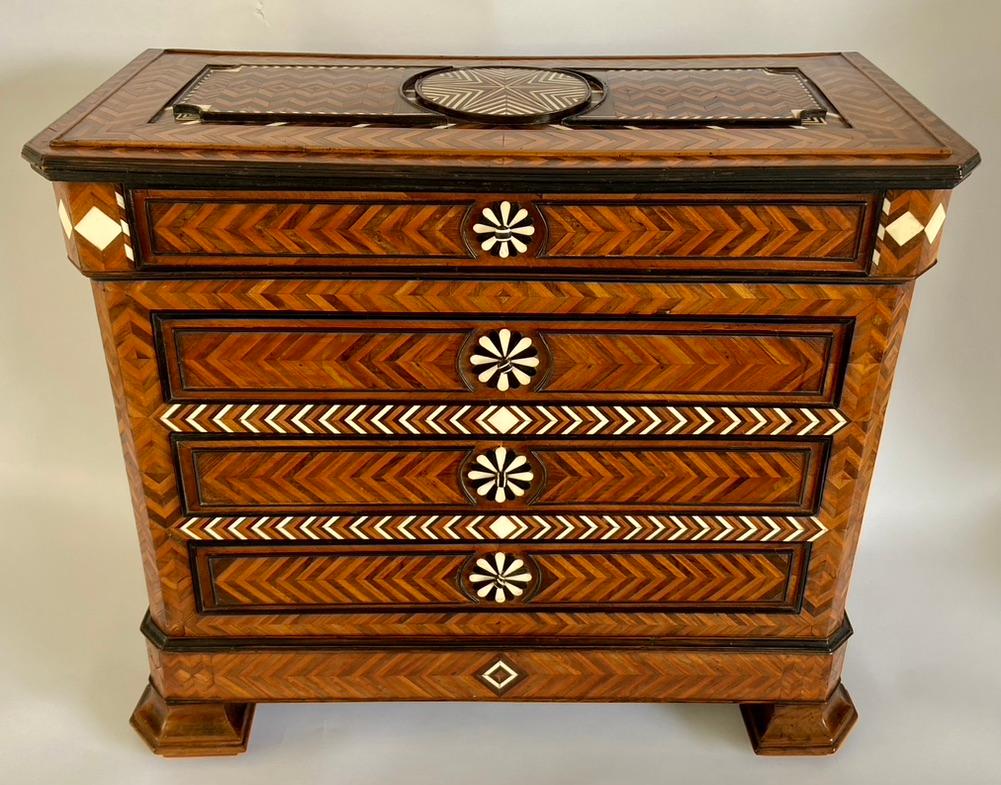 Very decorative small marquetry commode, Italy, circa 1850.
Inlaid with different woods such as mahogany and ebony. Bone has also been used.
The lovely masterpiece is in a very good condition.