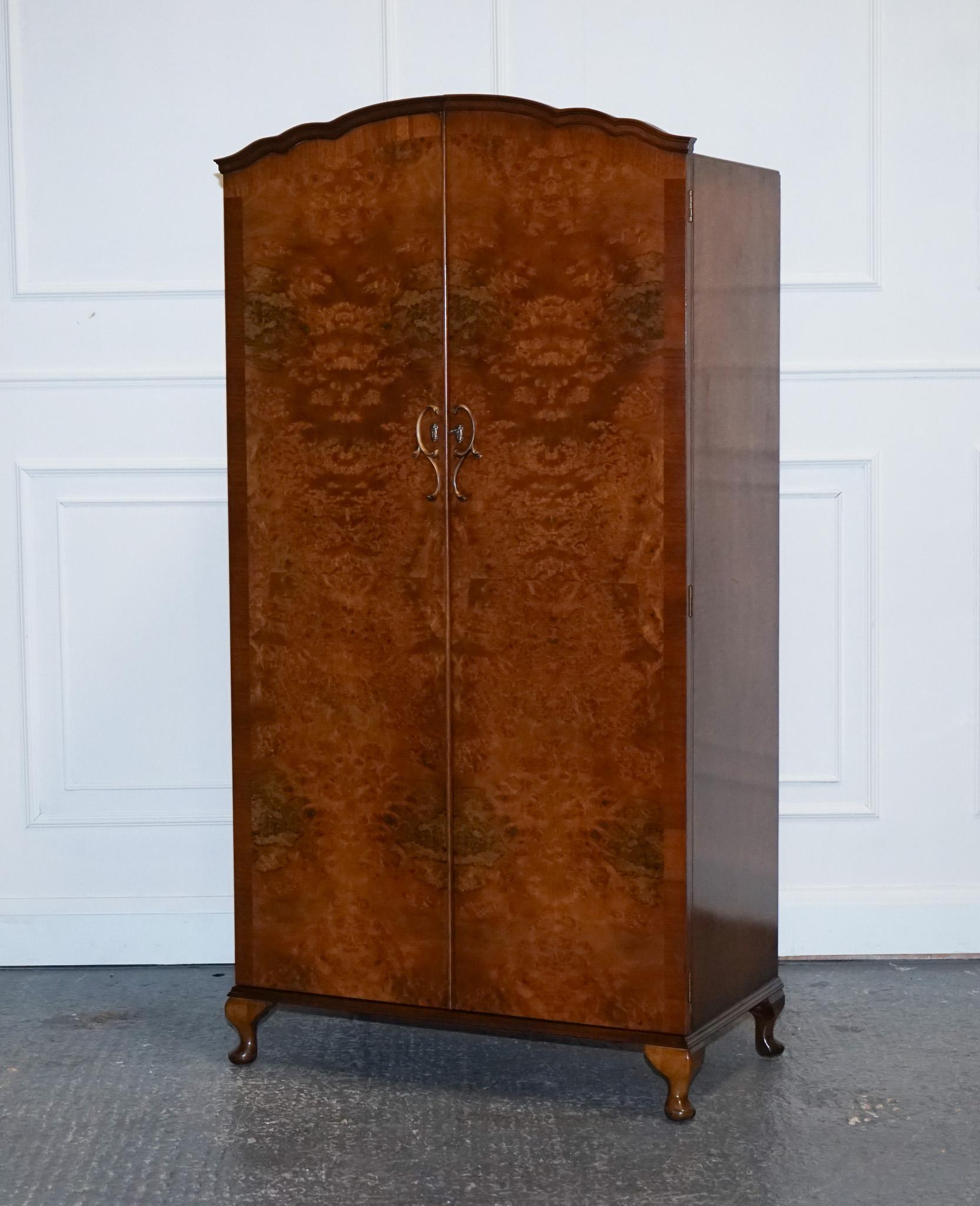 
We are delighted to offer for sale this Stunning Art Dec0 1940s Burr Walnut Wardrobe.

A small and compact Art Deco 1940s Burr Walnut Wardrobe is a charming and space-saving piece of furniture that embodies the elegance and style of the Art Deco