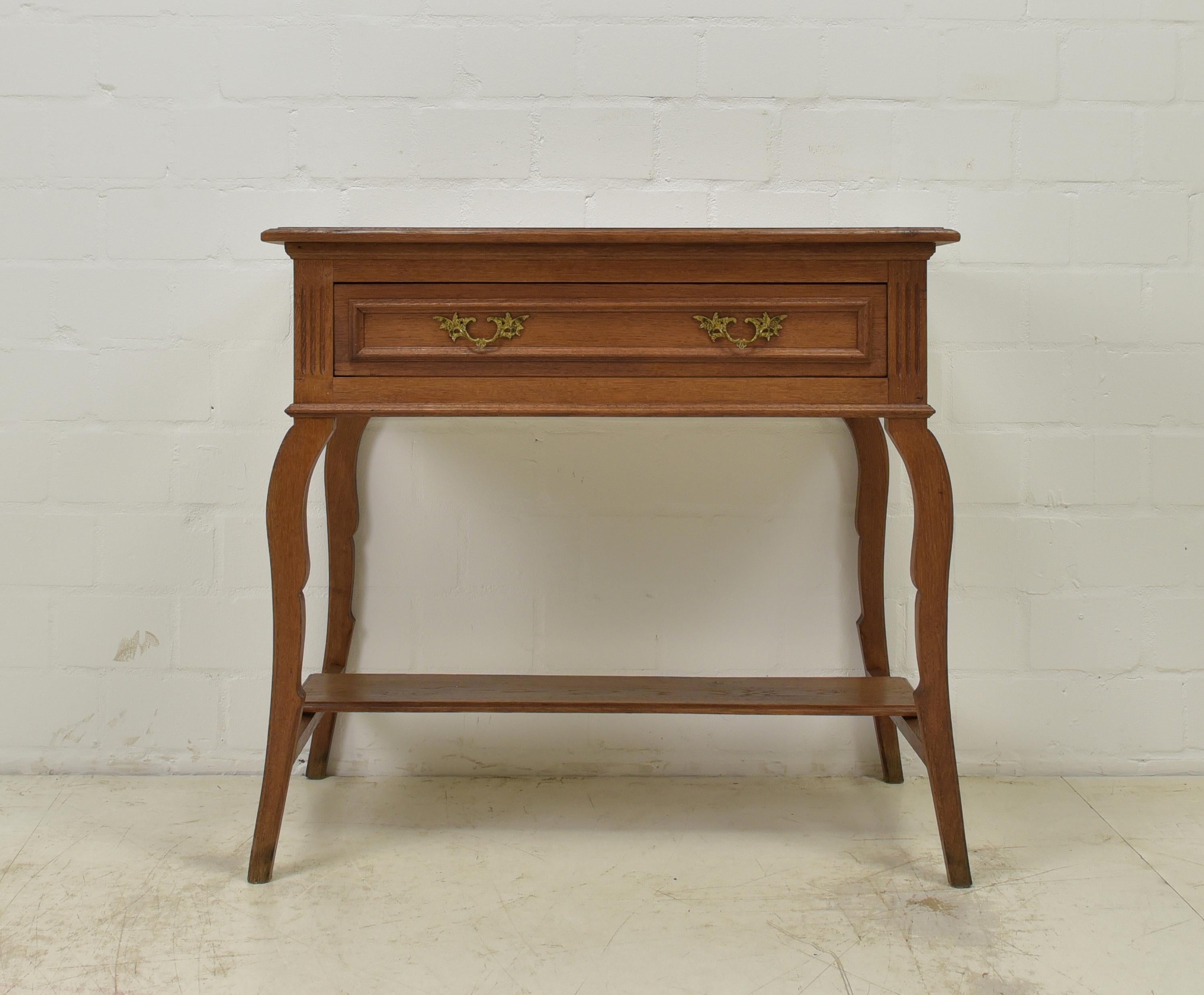 Small console table restored solid oak side cabinet wall table

Features:
High quality
Attractive, quite light color tone
Very nice condition
Rare model

Additional information:
Material: Almost entirely solid oak
Dimensions: 93 W x 57 D x
