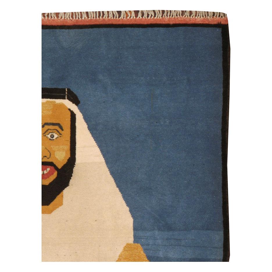 A modern Afghan Pictorial small throw rug handmade during the 21st century with a pictorial depiction of an Arab Bedouin falconer (raptor) in traditional garb holding a fan-tailed raven over a plain light blue background.

Measures: 4' 0