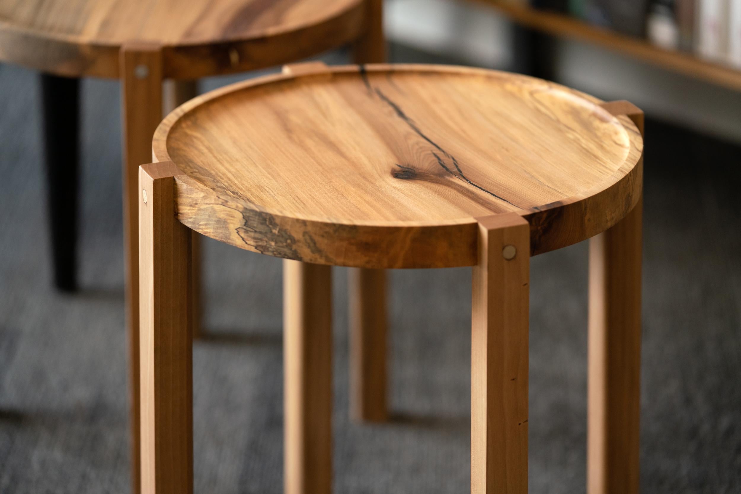 Introducing the waverly table. Small, round, lightweight with curves you want to touch, this versatile end table is made of the finest repurposed urban timber. A natural wood finish on sweet gum, often called 