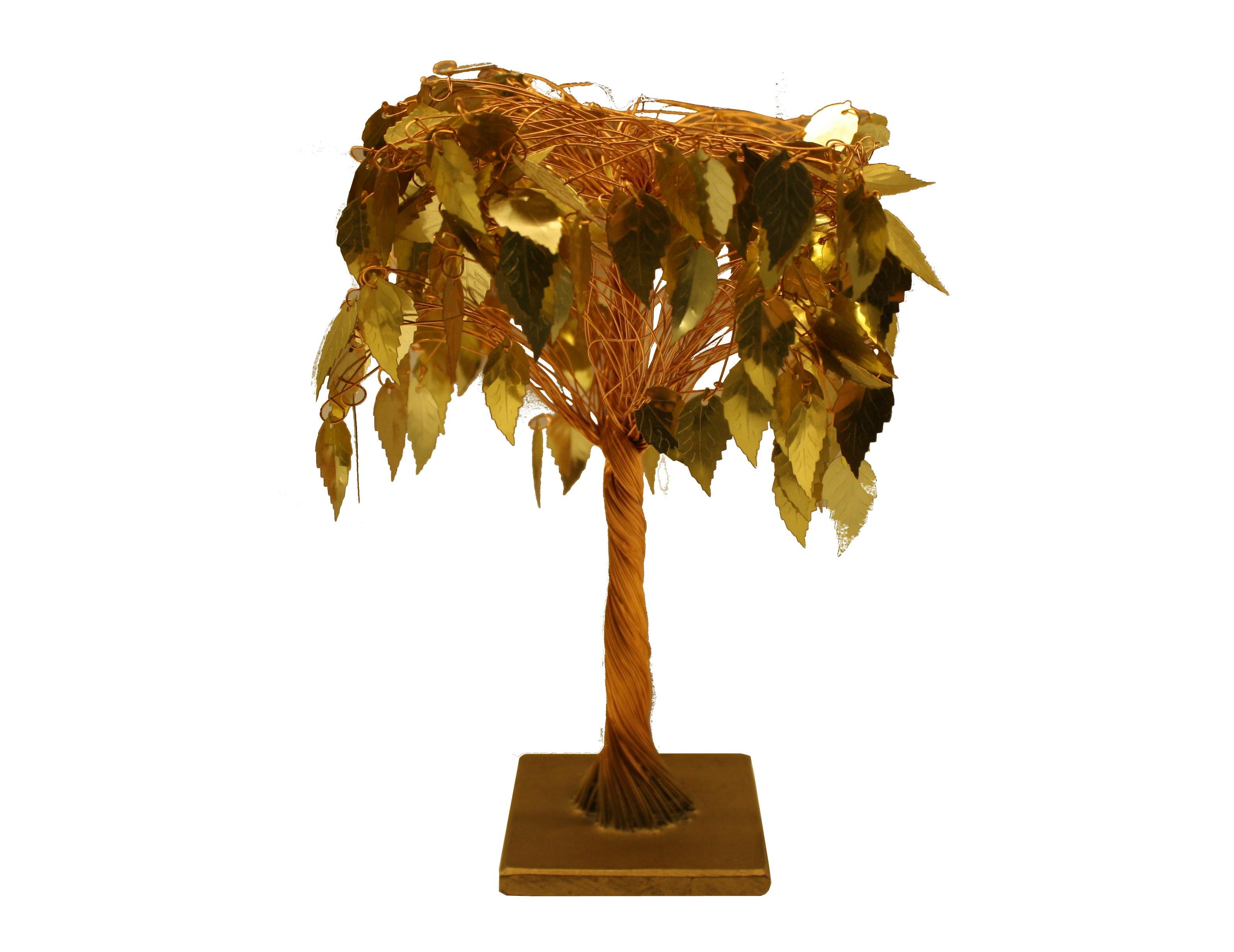 Small decorative tree made from woven copper and gold coloured leaves.

This comes from a gift shop in antwerp, belgium.

Lovely small decorative item.

Measures: Height 22cm/8.66