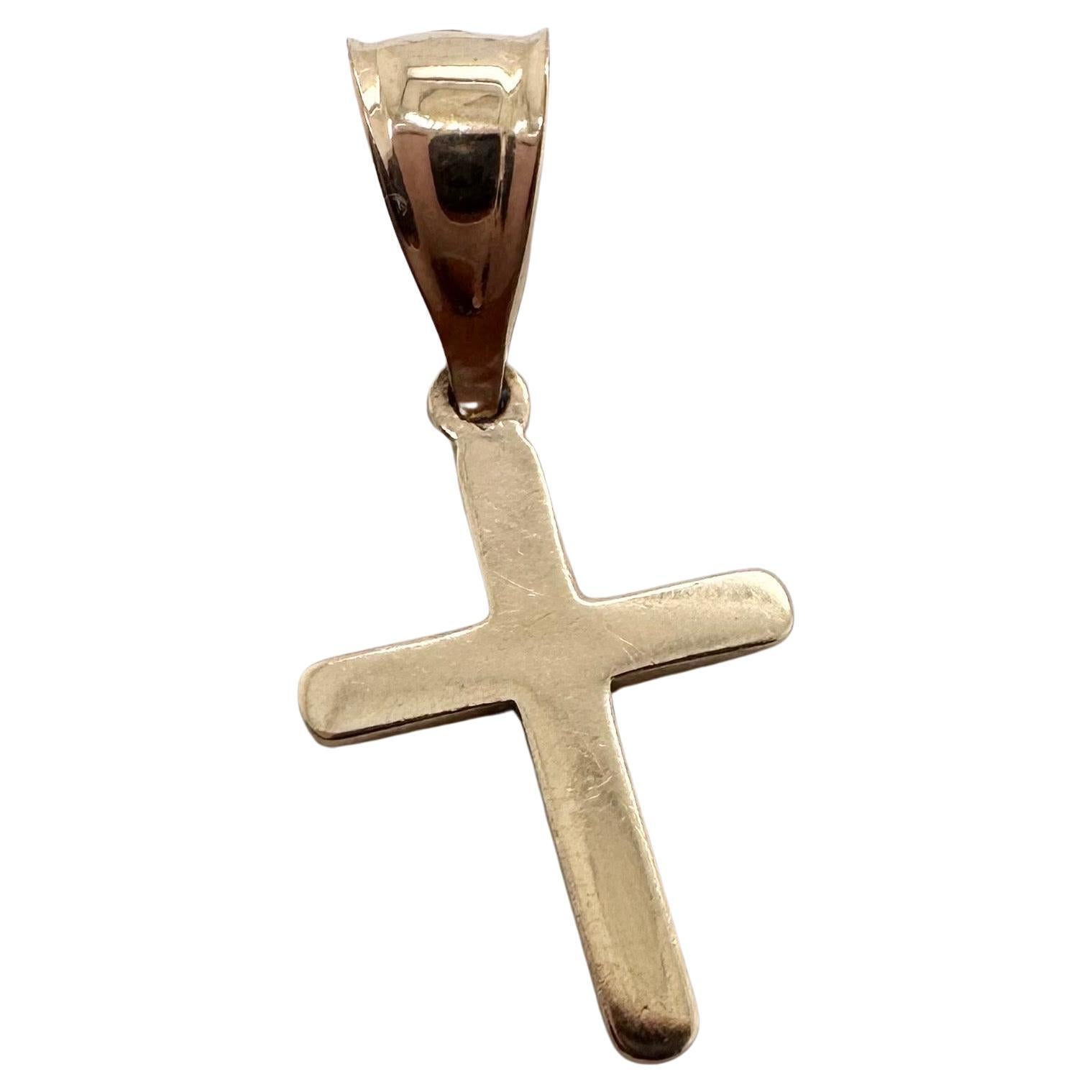 Petite croix en or massif 10kt en vente