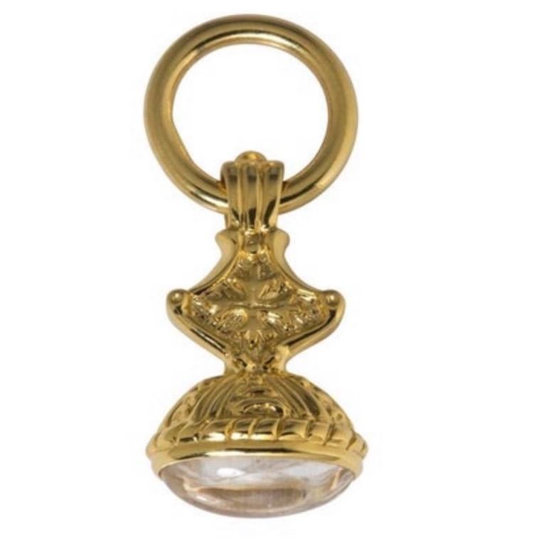 Dudley VanDyke's Small Cross Fob is featured in 14K Yellow Gold with a Clear Quartz cabochon.  The Small Cross is also available by custom order in Sterling Silver. This piece is typically made to order, though we may have one in stock. For an