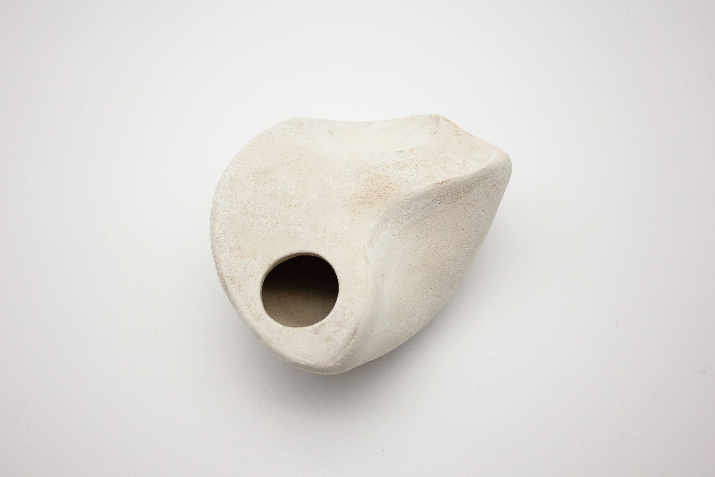 The small curved form with Hip and Plinth blurs the boundary between a functional vase and a sculptural object. Created as part of the soft, soft hard 2018 collection, this piece is an exploration into form and the relationship between the wheel and