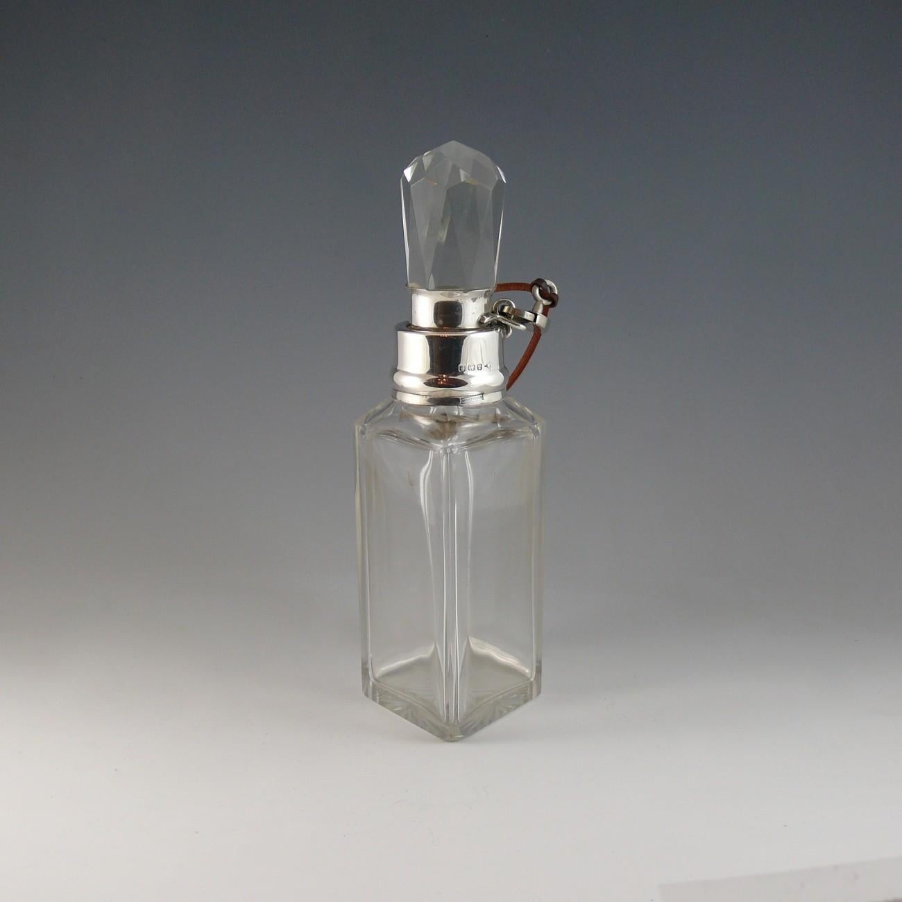 An elegant lozenge shaped cut glass locking decanter with Sterling silver collar hallmarked Birmingham, 1917.

Dimensions: 21 cm/8¼ inches (height)

Bentleys are Members of LAPADA, the London and Provincial Antique Dealers Association.  

All prices