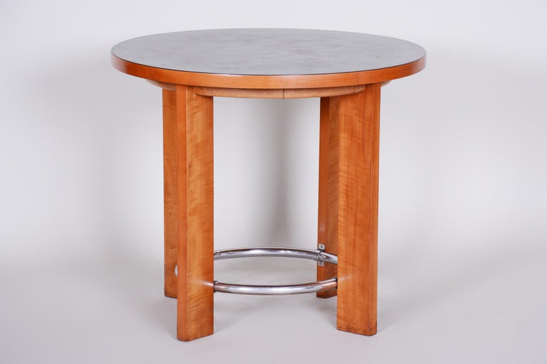 Art Deco table, Czech
Restored. 
Material: Walnut, marmoleum, chrome.