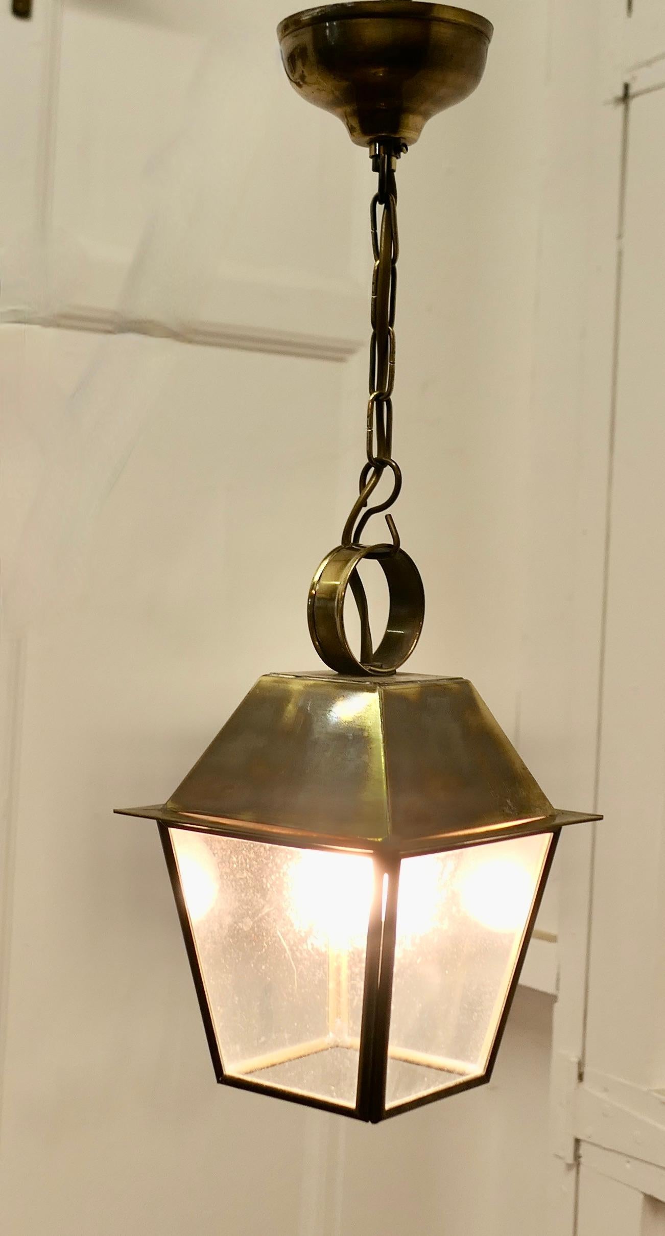 Small Dainty Brass Pendant Lantern

This is a dainty Lantern it has 4 glazed sides
The lamp is wired for electricity and ready to  hang it will have to be connected to an electrical supply
This is a very attractive piece for when a larger piece is