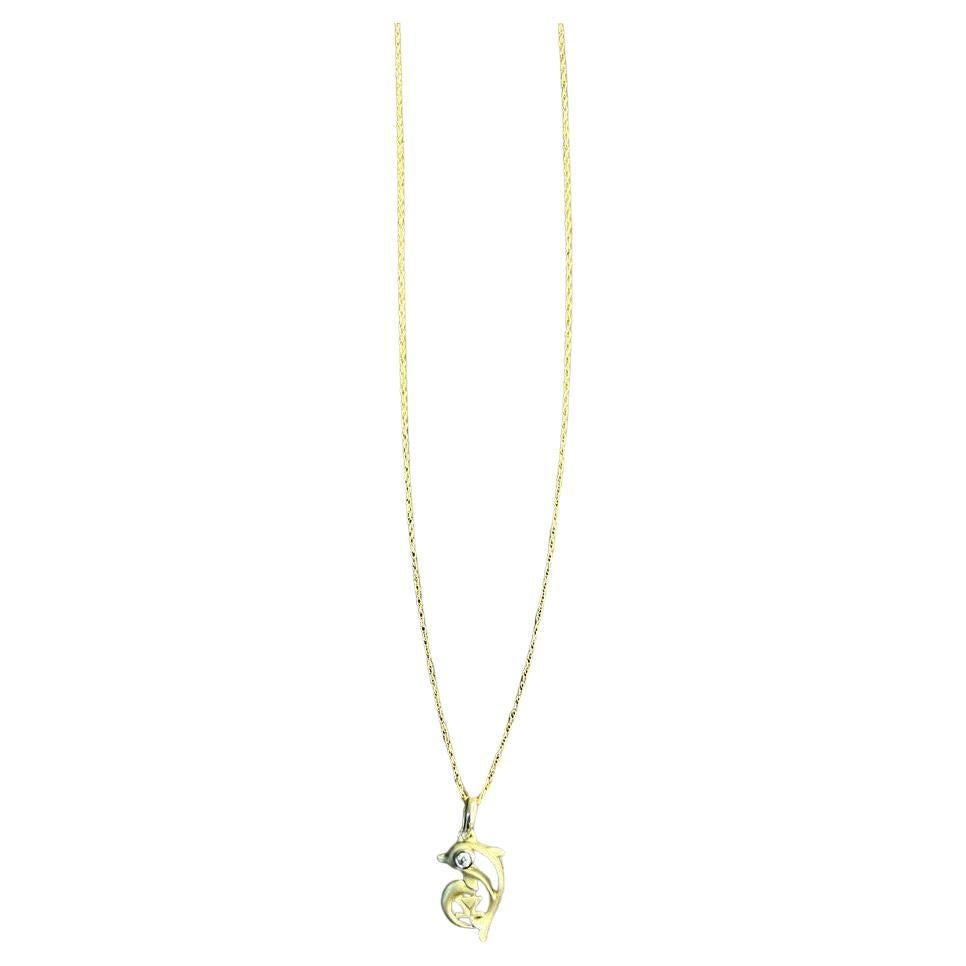 Piccola collana minimalista con ciondolo a forma di delfino in oro giallo 14 carati
