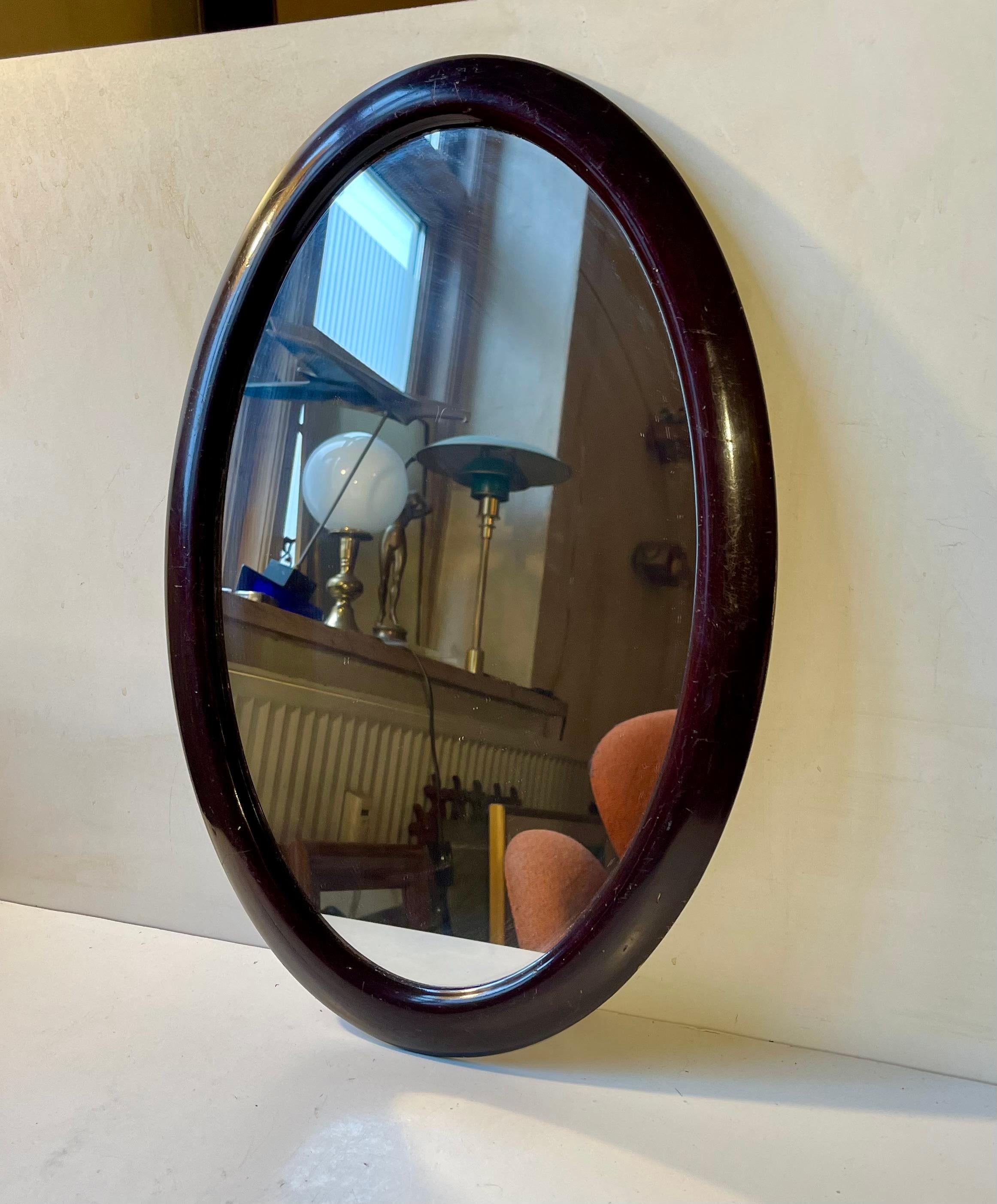 European Small Danish Antique Oval Wall Mirror in Stained Oak, 1920s For Sale
