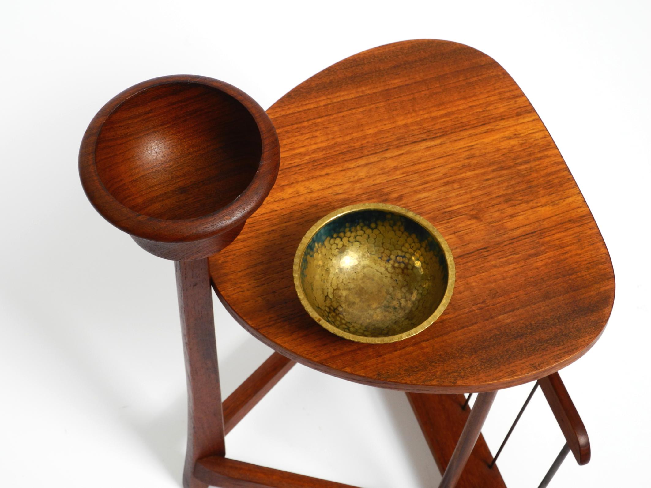Small Danish Mid Century teak side table with magazine compartment and ashtray 1