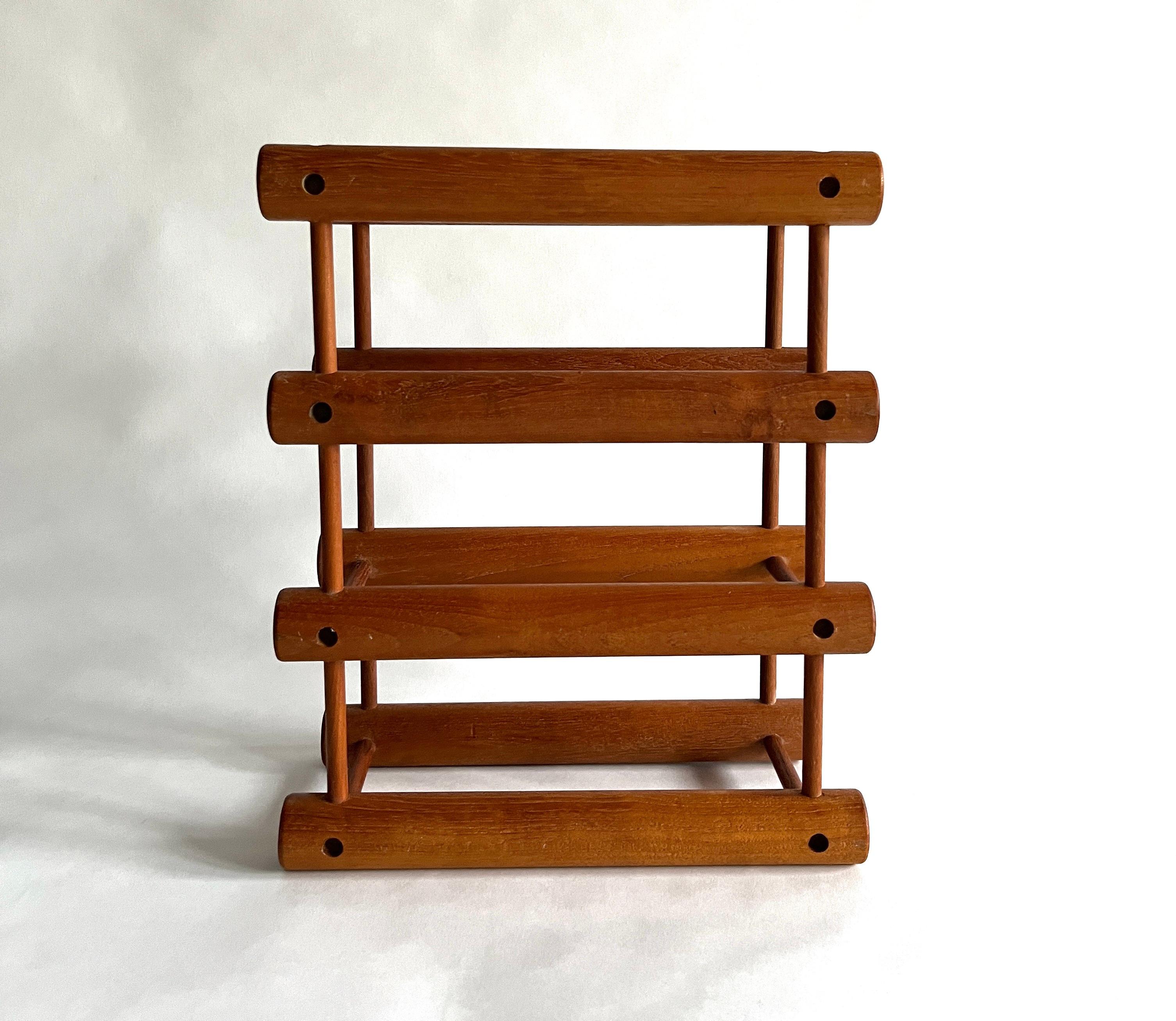 Original vintage Danish modern teak modular wine rack designed by Richard Nissen and made in Denmark by Langaa. Holds three wine bottles (or 6, depending how you orient it). Ingenious design consisting of solid teak pegs and dowels which can be