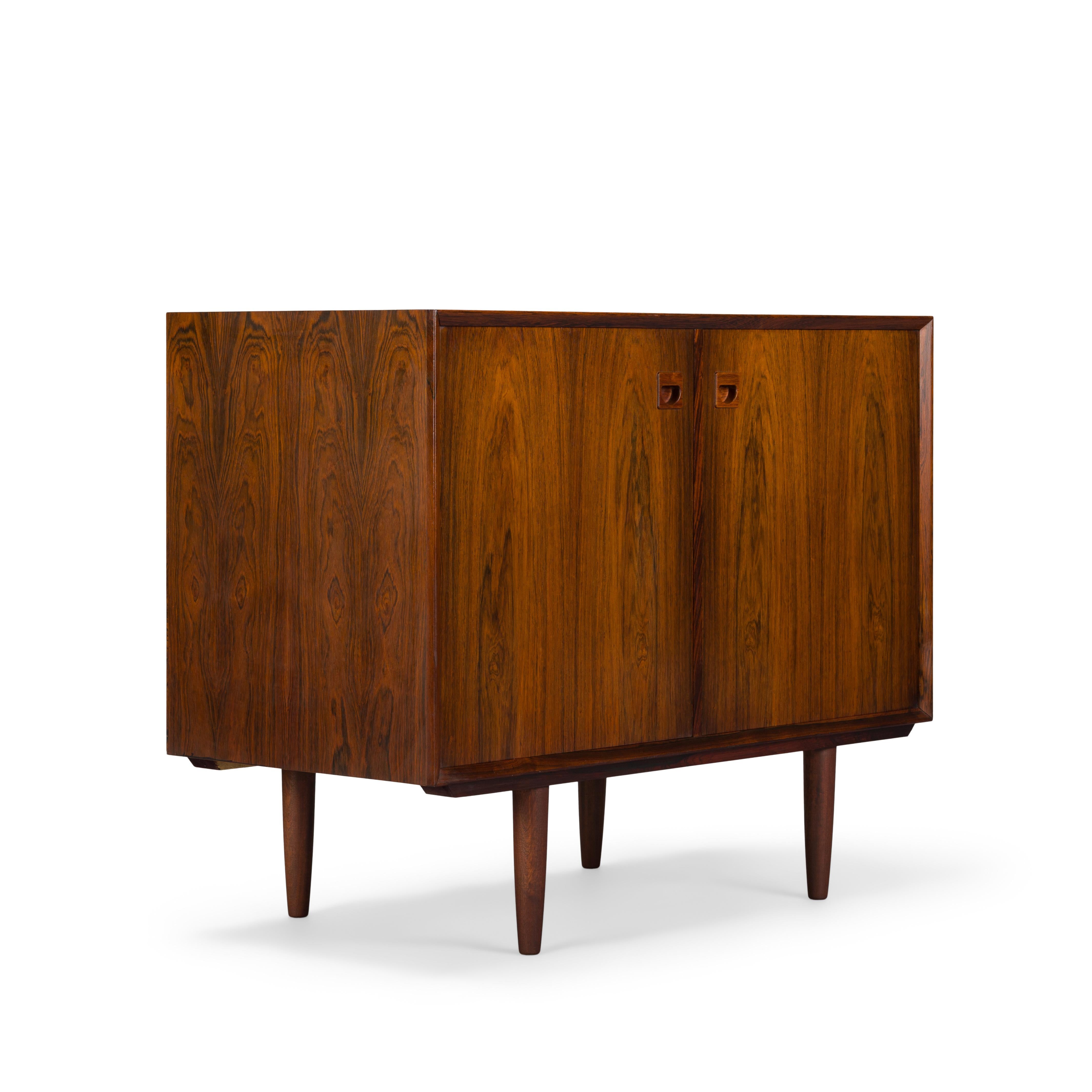 Two-door 'Tight Fit' sideboard designed by E. Brouer and manufactured by Brouer Møbelfabrik. An eyecatcher in every hallway, study or living! This sideboard has two doors, each opening up to one segment, that's it! Behind each door is a height