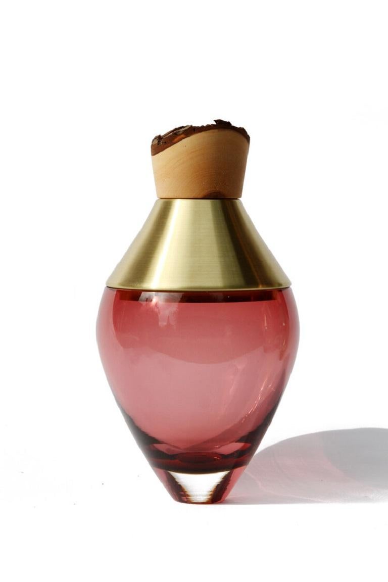 Small dark rose India vessel I, Pia Wüstenberg.
Dimensions: D 15 x H 30.
Materials: glass, wood.
Available in other metals: brass, copper, copper patina, aluminum.

Handmade in Europe, by individual craftsmen: handblown glass (Czech Republic),