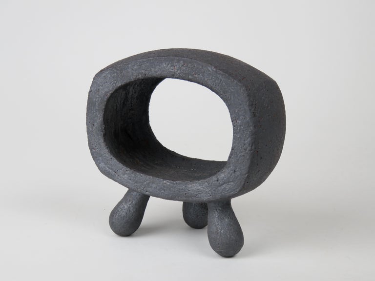 A small hand built rectangular ring ceramic sculpture on 3 legs, one in an ongoing series of Primitive Modern TOTEMS. This study, by artist Helena Starcevic is an investigation into the connection between our modern sensibilities and the essence of