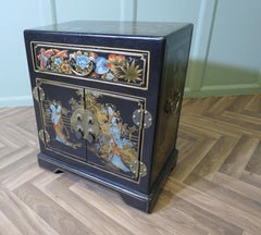 Small Decorated Chinoiserie Cupboard  The cupboard is in black lacquer