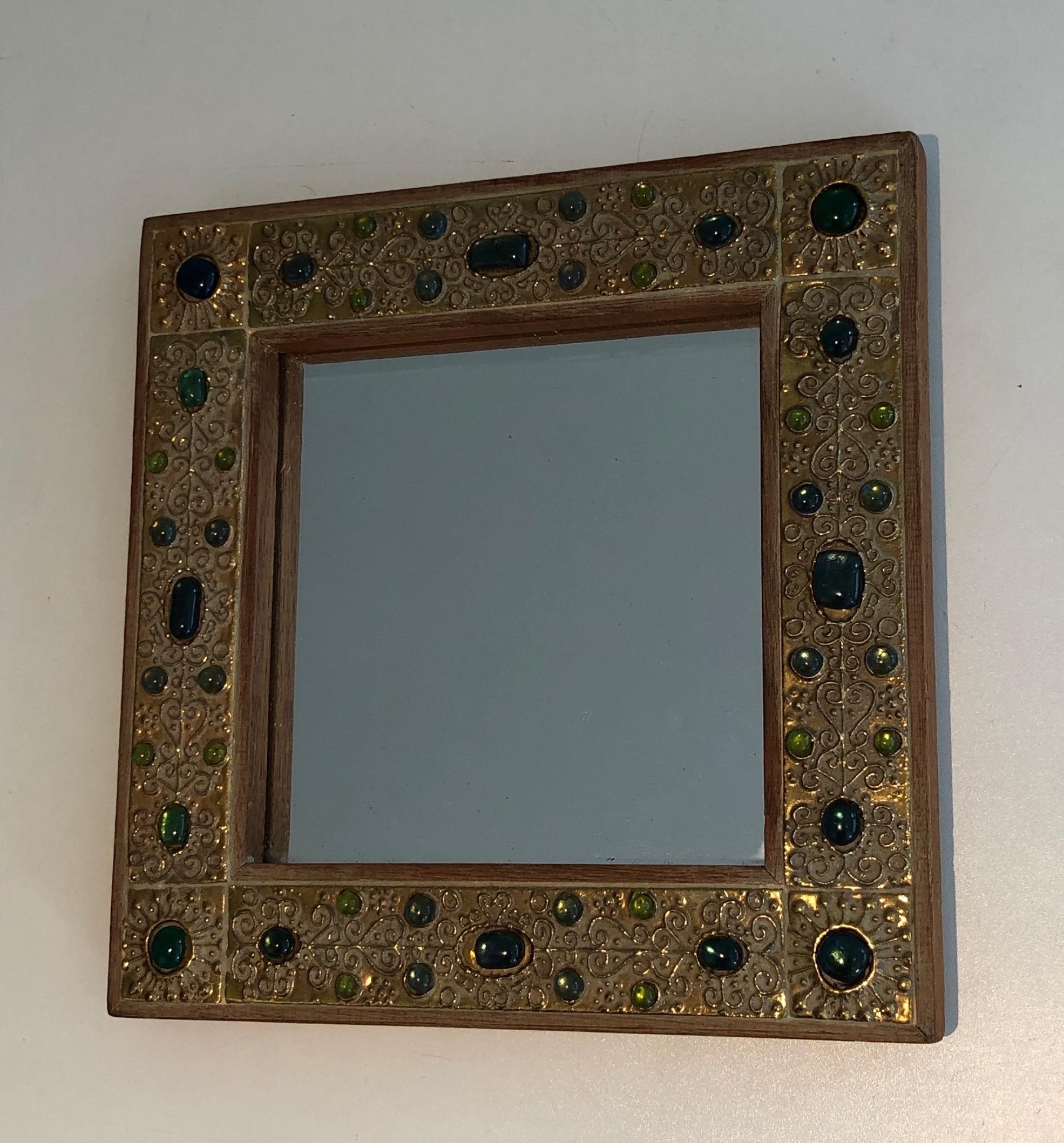This small decorative mirror is made of lucite ornaments. This is a French work. Circa 1970.