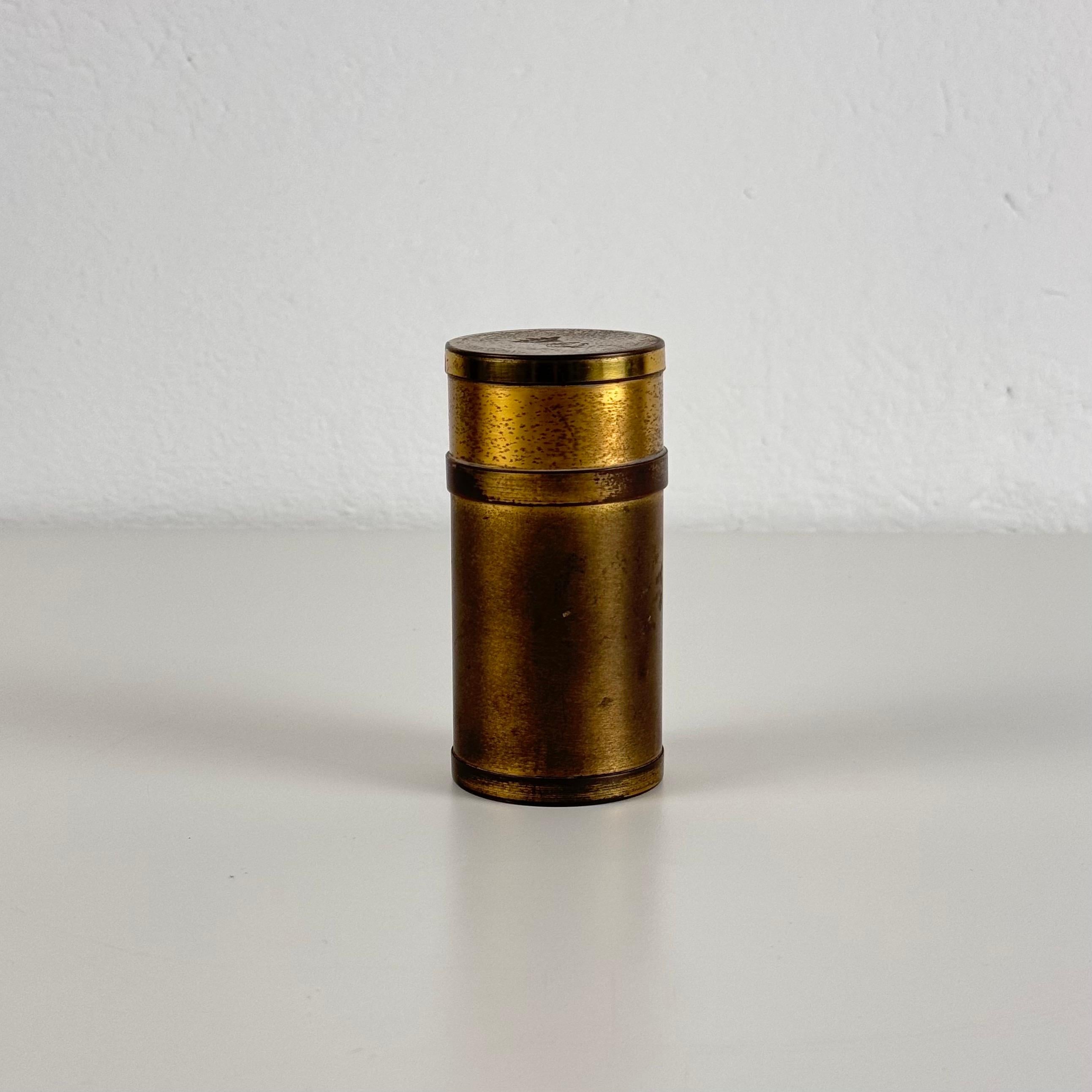 A beautifully crafted small round box by the renowned Italian designer Gabriella Crespi, dating back to the 1960s. This exquisite piece is crafted in brass, showcasing Crespi's signature minimalist yet elegant design style. The box features a