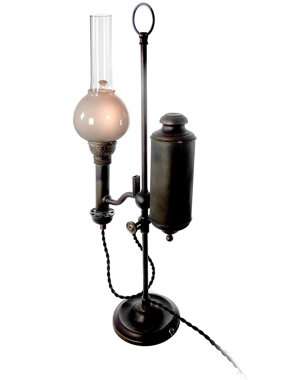 A Victorian period student desk lamp from about 1875 is solid brass, and was meant to burn oil or kerosene. The tank is off to the side, helping light shine down onto a desktop. This lamp is now electrified and takes standard E12 bulb.
We left the