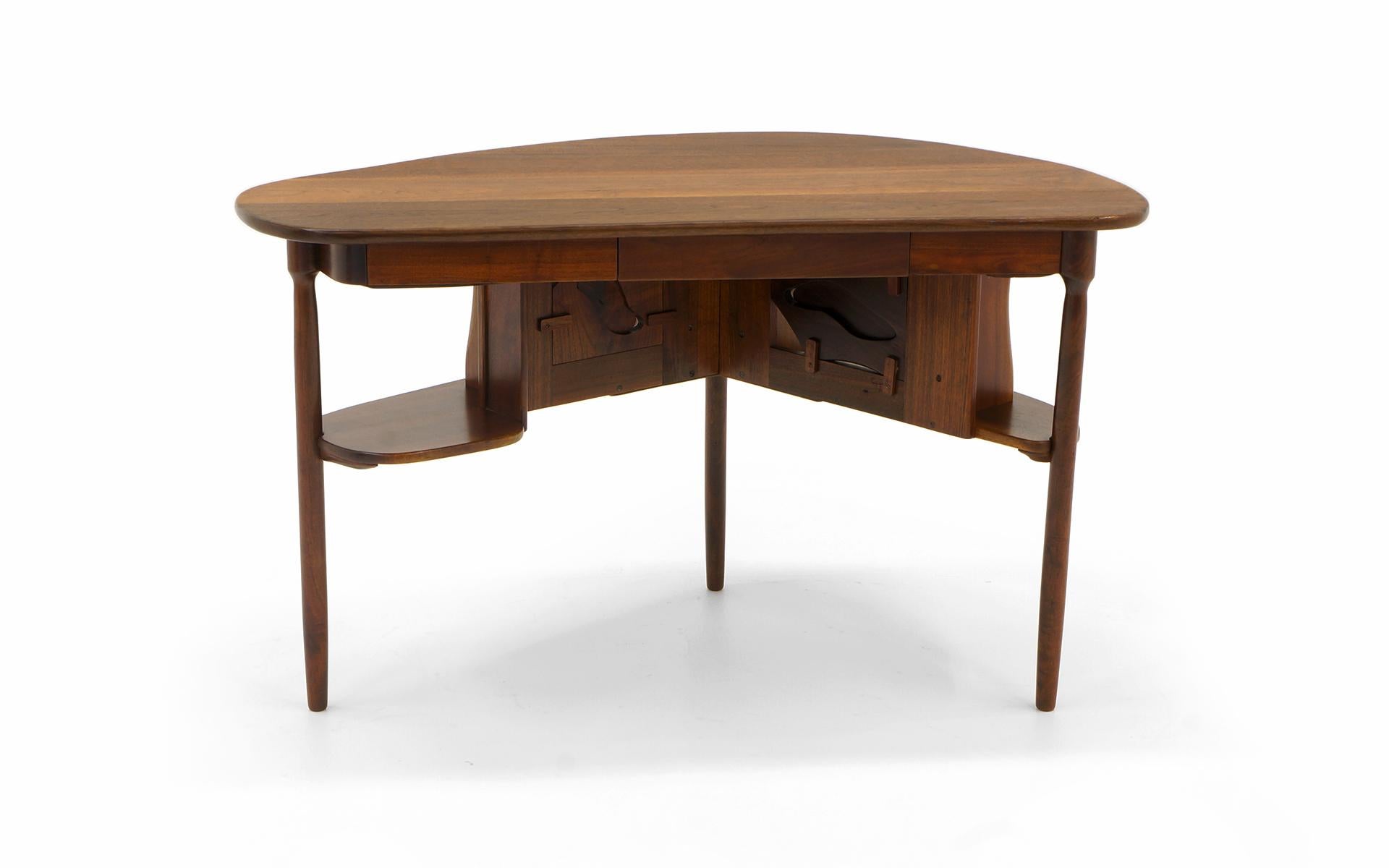 Sculptural desk in from the studio of Clarence Teed, early 1960s. Teed was a contemporary of George Nakashima, Phillip Lloyd Powell, Sam Maloof and others. As functional as it is beautiful, this desk in entirely had made from solid black walnut. A