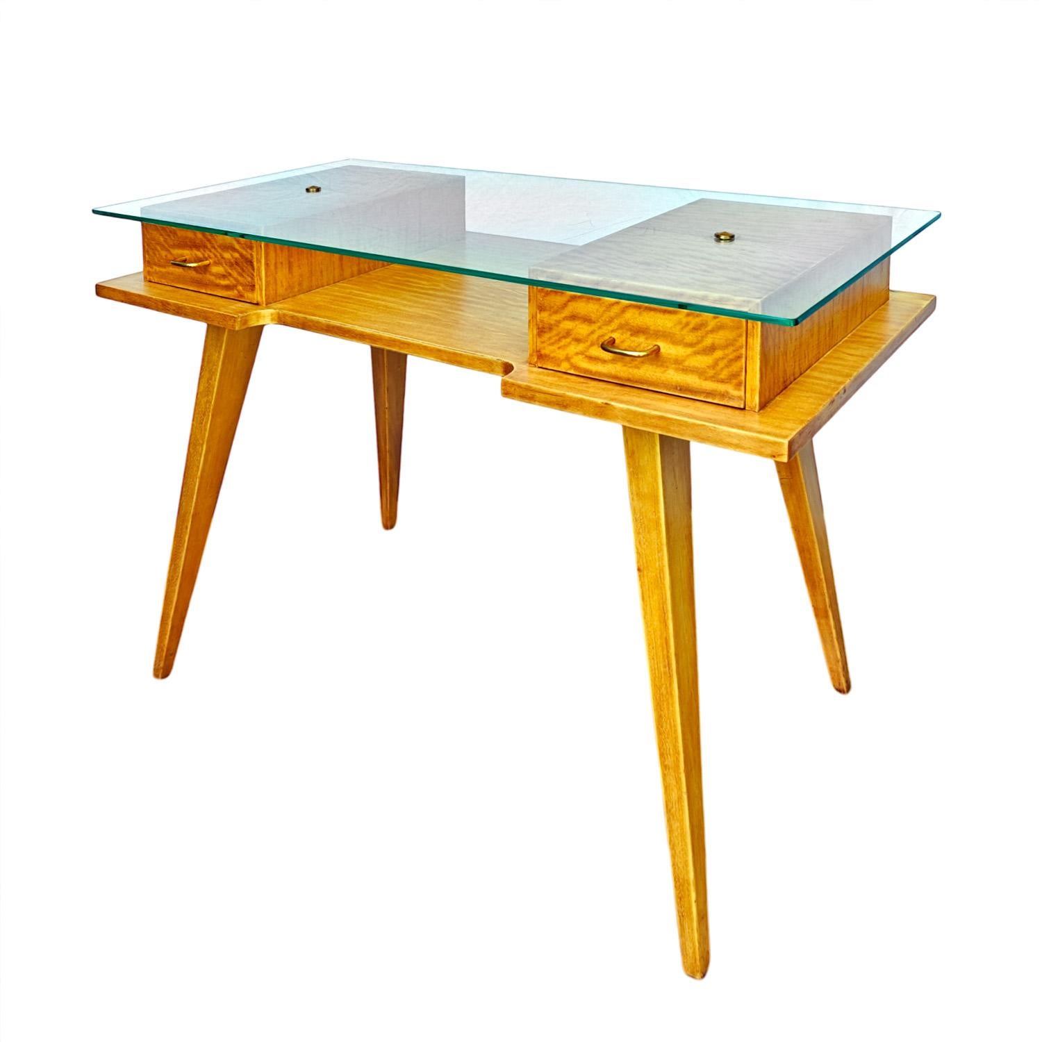 Small desk in solid lemon wood and lemon wood veneer, waxed finishing. Original glass top, polished brass cabochons.

France circa 1950