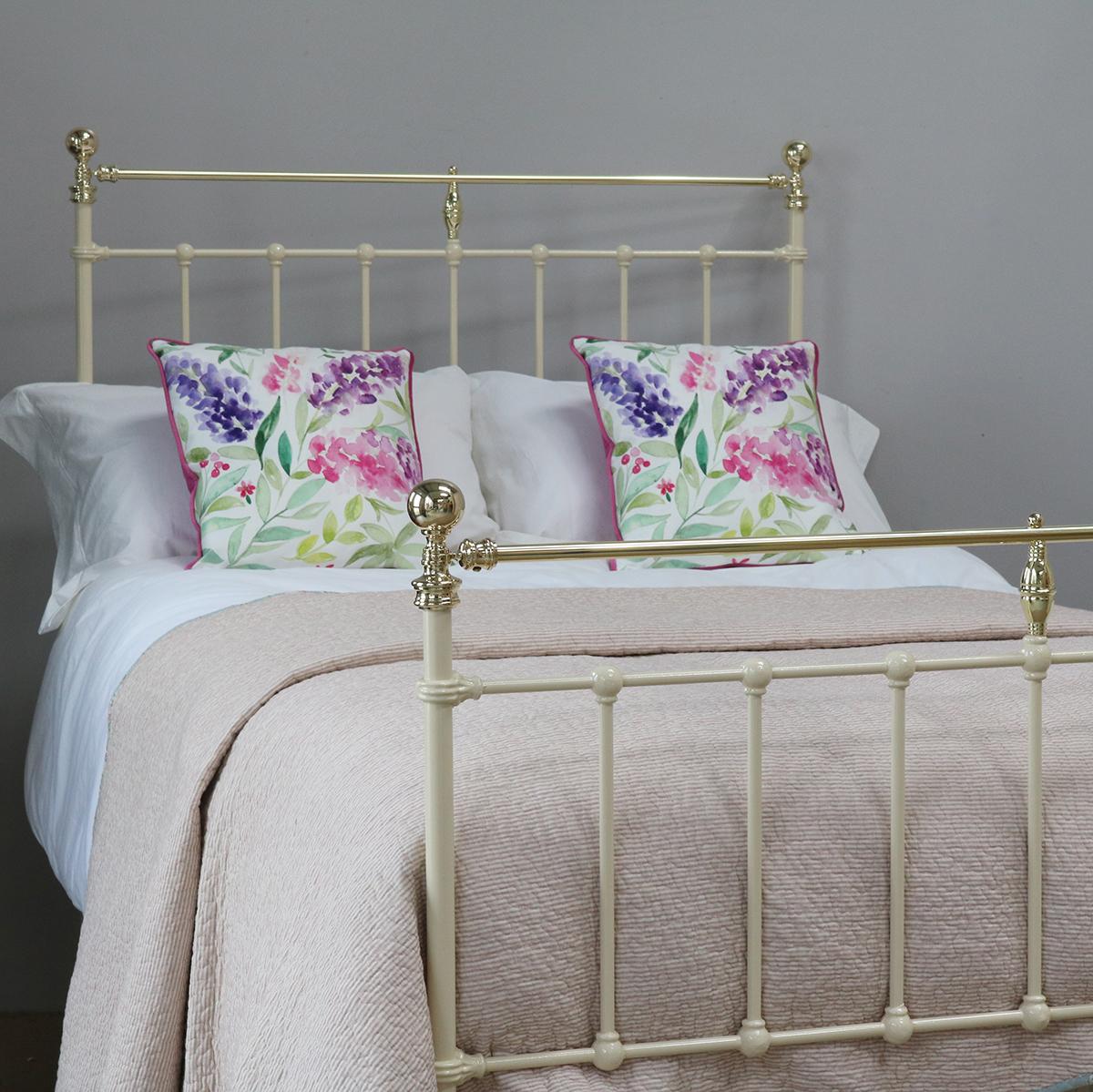 Cream antique bed in brass and iron with straight brass top-rail and simple castings.

This bed accepts a small double size (4ft wide, 48 inches or 120cm) base and mattress set.

The price includes a standard firm bed base to support the mattress.