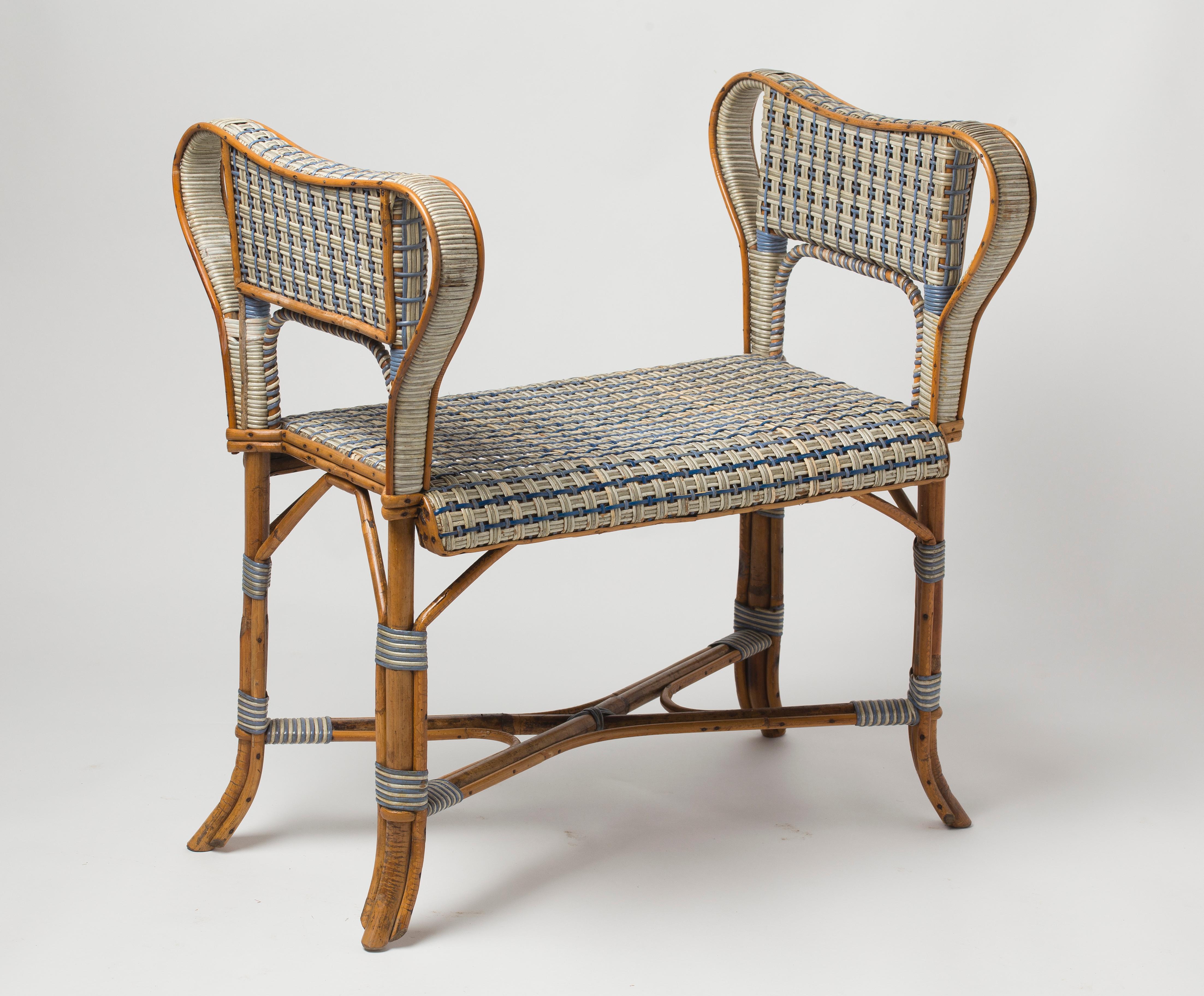 Lovely little bench with double cane armrests, in blue and white lacquered rattan. 
Probable work of Maison Perret-Vibert in 1880, but doesn't bear the plaque.