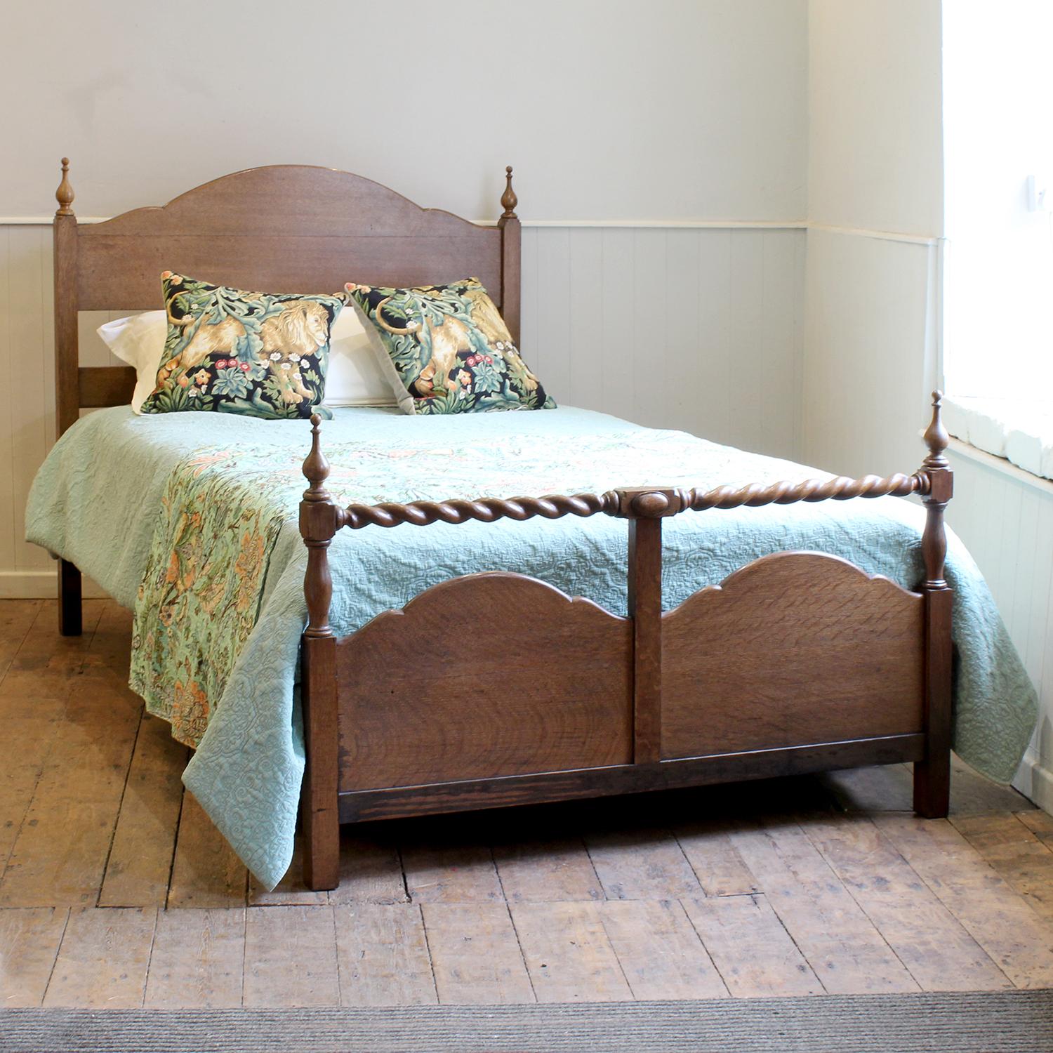 A small double bed in oak with barley twist posts and dleicate finials.

This bed accepts a small double, 4ft (48 in), base and mattress set.

The price is for the bed frame and a firm bed base. 

The mattress, sprung bed base, bedding and linen are