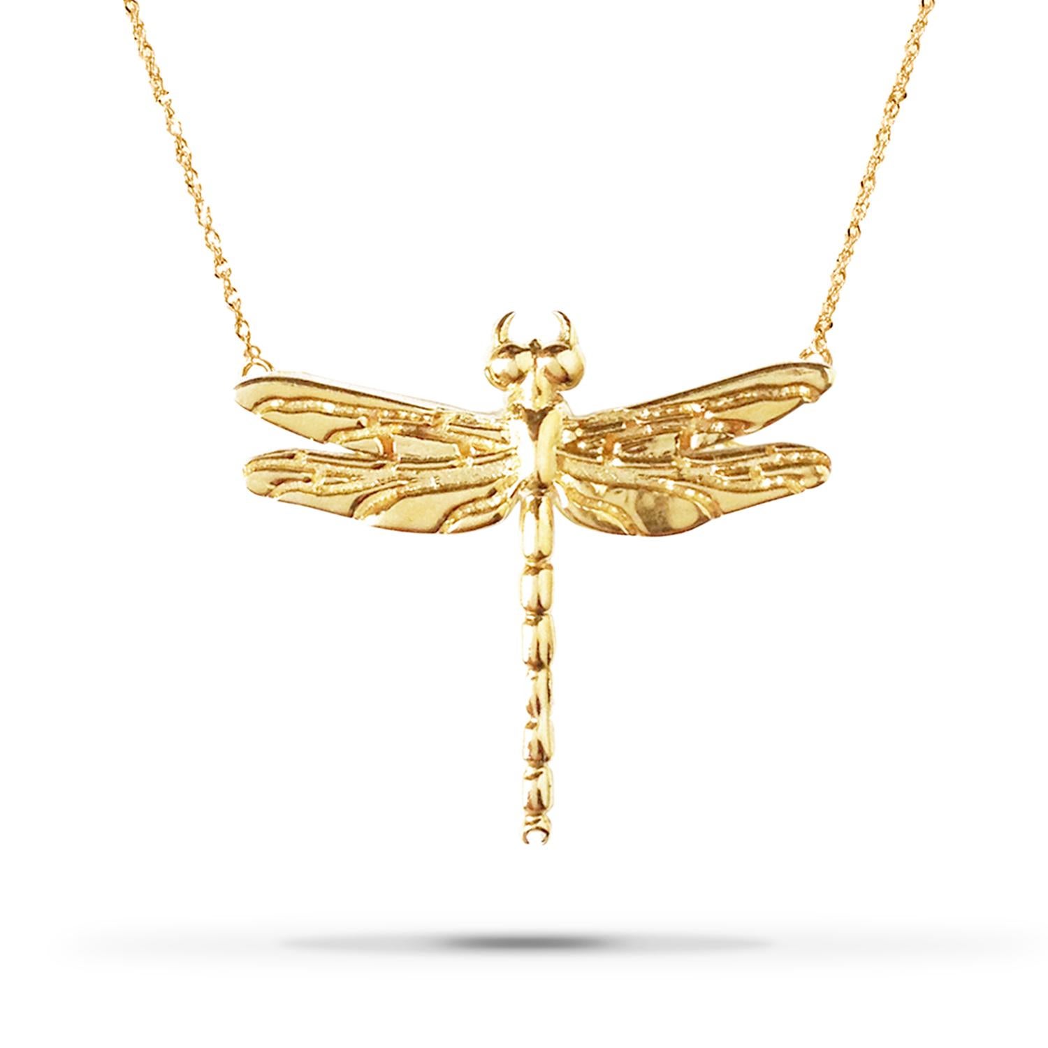 Experience the ethereal beauty of our Small Dragonfly Necklace in Solid Gold. Symbolizing adaptability and the radiance of light, dragonflies captivate with their otherworldly allure.

Crafted with precision, this necklace showcases a stunning