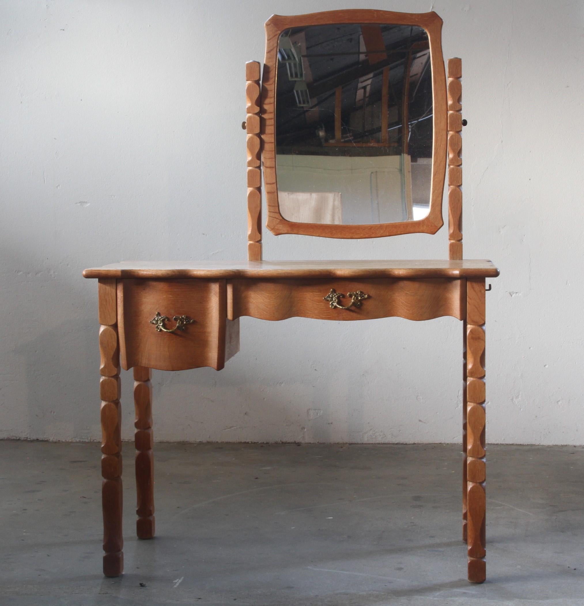 This beautiful piece showcases Kjærnulf's classic design, featuring intricate Baroque-inspired wood carvings on the legs and tabletop. The carved curves create a soft, wave-like flow, giving the table a smooth and elegant appearance. Its compact