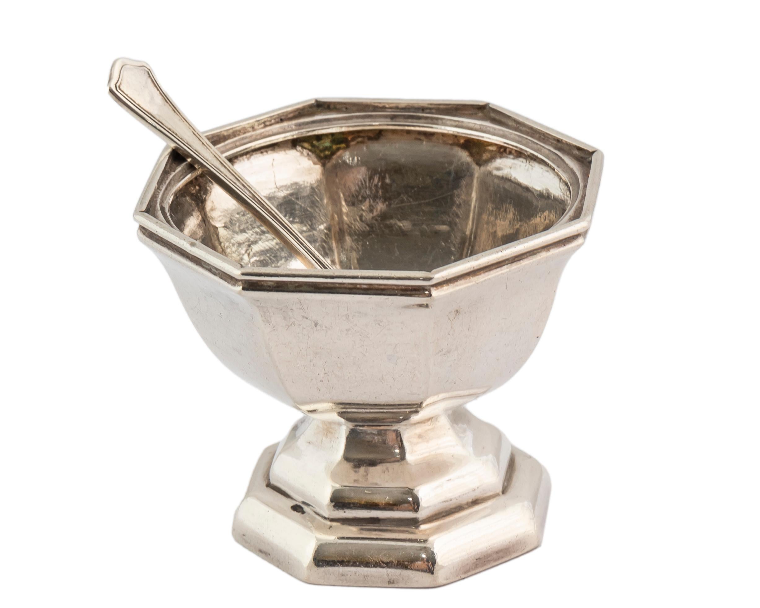 Charming miniature Dutch octagonal bowl possibly patterned on a sugar bowl first introduced in the Netherlands in the 18th century, on an octagonal pedestal stand, made in 1918, together with a tiny silver spoon.  

In early 18th century Netherlands