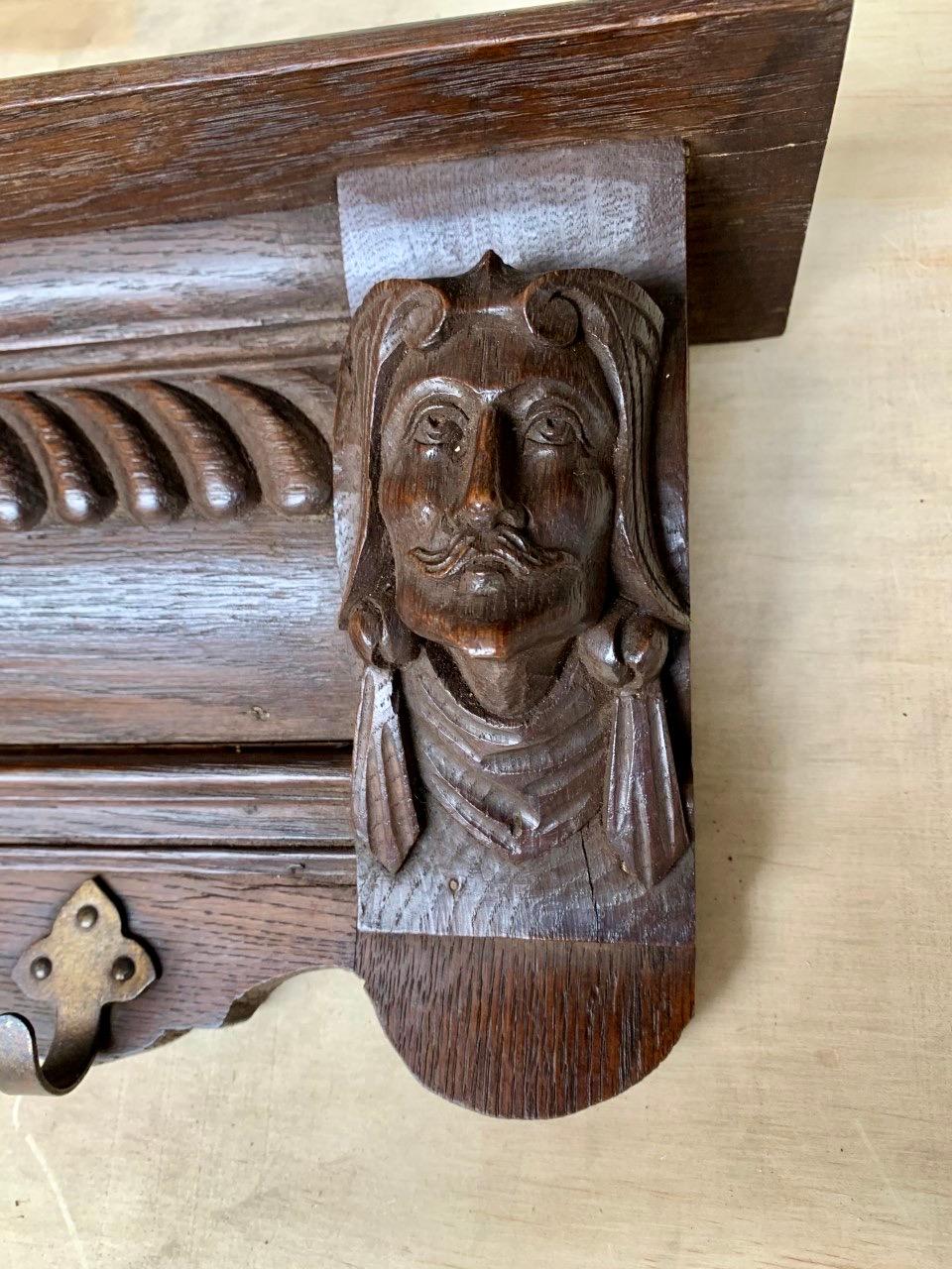 Dutch Small Early 1900s Renaissance Revival Wall Coat Rack with Carved Mask Sculptures For Sale