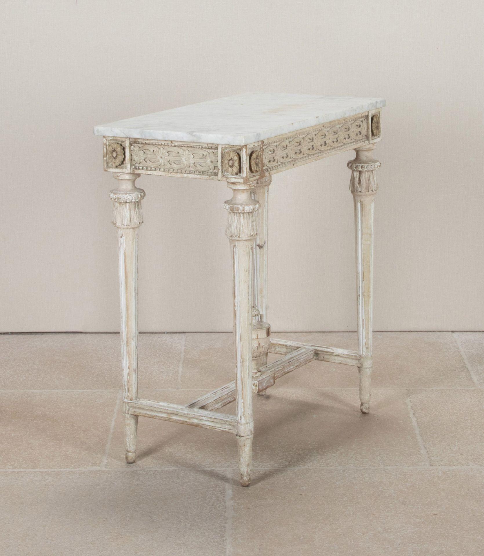 A small highly carved early 19th Century Swedish Gustavian period console table. 
In original paint with a Carrara marble top.