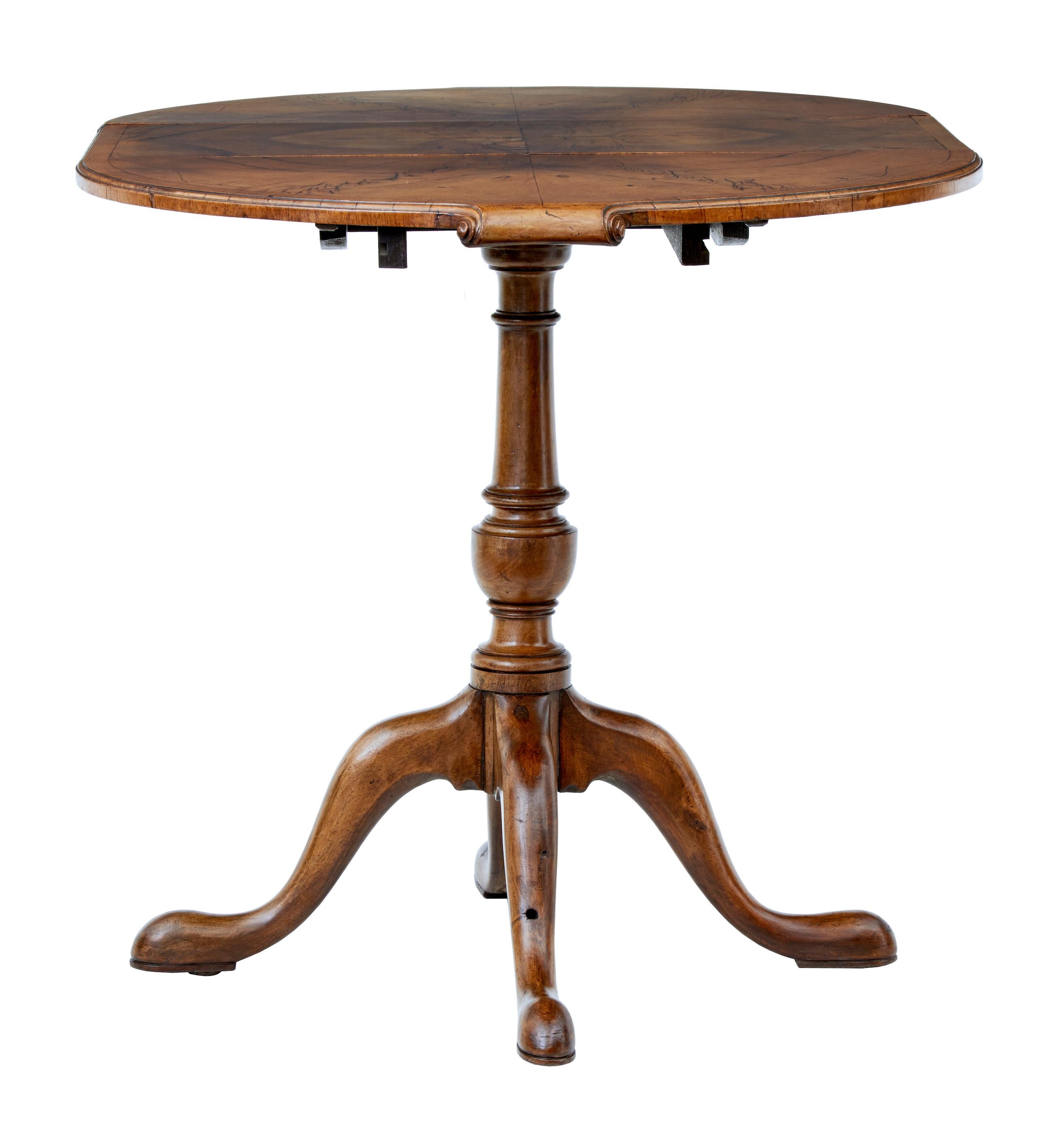 Small early 20th century walnut occasional extending table circa 1920.

Practical table of small proportions. Operates as a round table with the addition of a leaf for extra length. Matched walnut veneers.

Ideal table for areas of limited