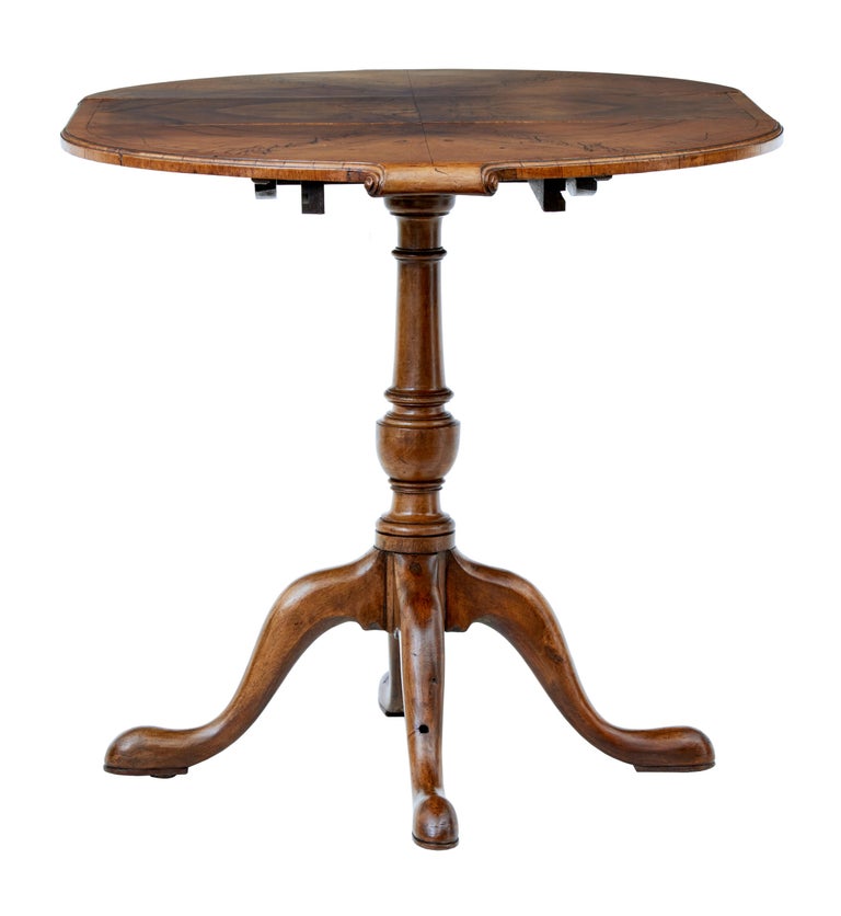 Small early 20th century walnut occasional extending table circa 1920.

Practical table of small proportions. Operates as a round table with the addition of a leaf for extra length. Matched walnut veneers.

Ideal table for areas of limited