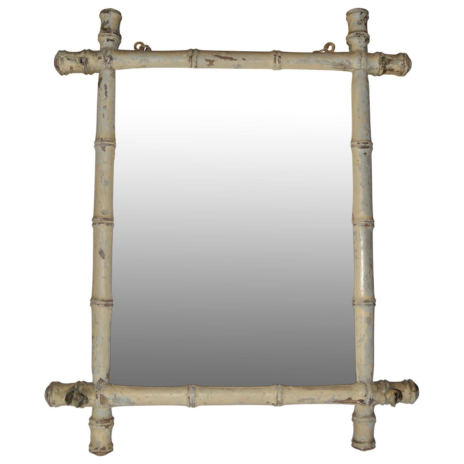 Small early 20th century white-painted French faux bamboo wall mirror.