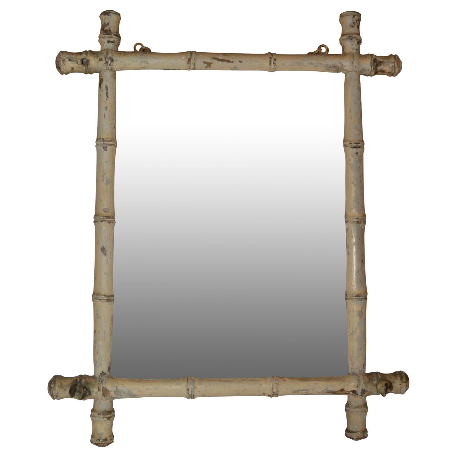 white faux bamboo mirror