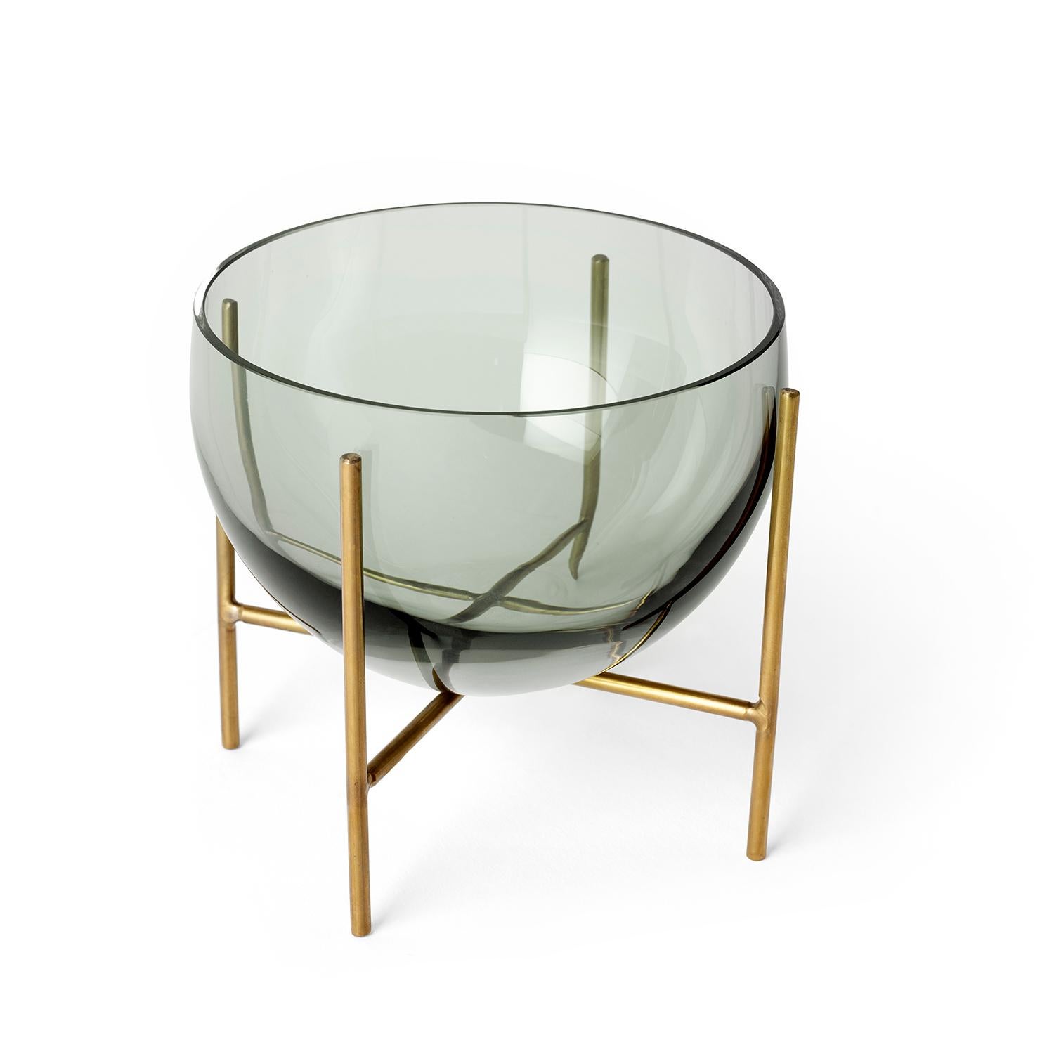 A new addition to the Echasse series by Theresa Arns for Menu, Echasse bowl combines the elegance of a traditional glass bowl with a playful and light expression, created by four slender brass legs that elevate it into the air. The word échasse is
