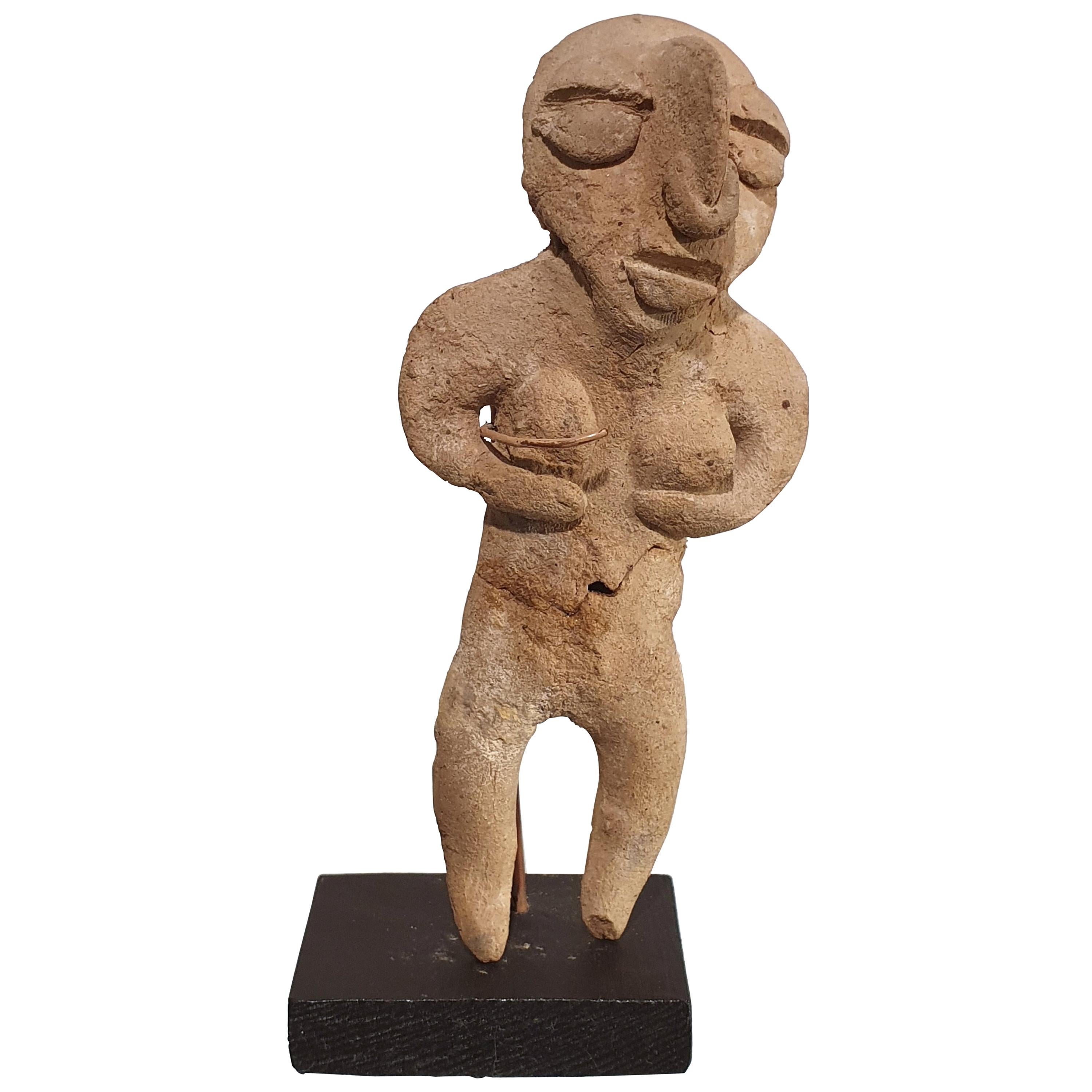 Small Ecuadorian Moulded Clay Figure on Stand For Sale