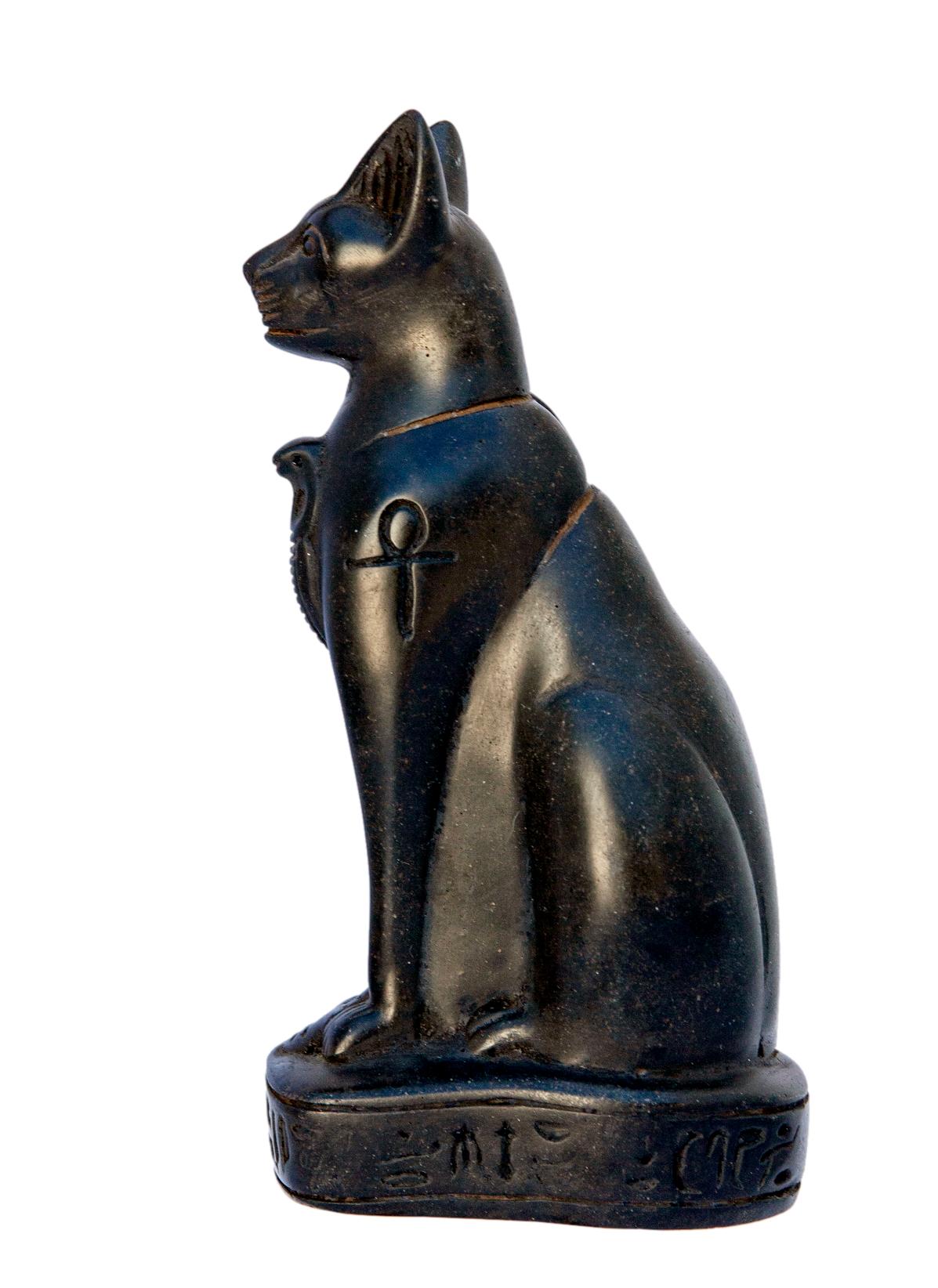 Epyptian goddess of love, the baset cat figurine has been cast in a black stonelike material. Very heavy for its size.
.