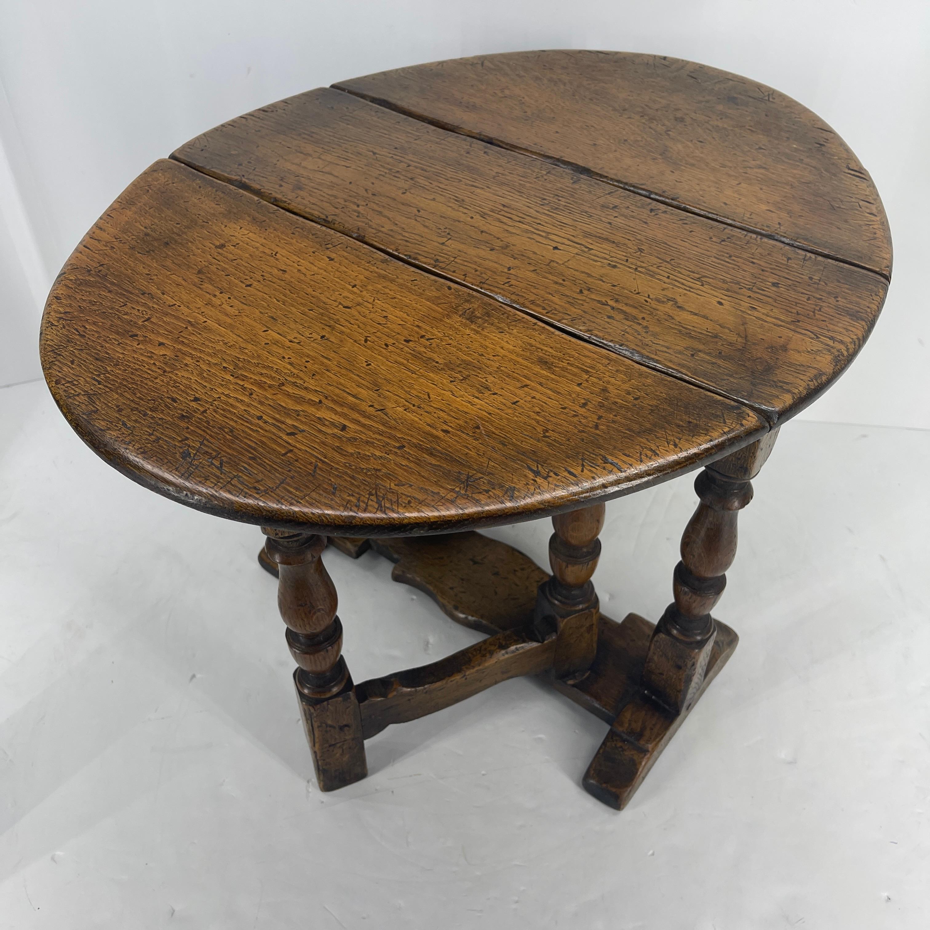 Rare small Victorian oak salesman sample Gate leg table. Boasting a marvelous top with two drop leaves, it has two swing out gate legs for support and is raised on shaped feet united by a flat oak stretcher. This is a rare little piece; it is, as