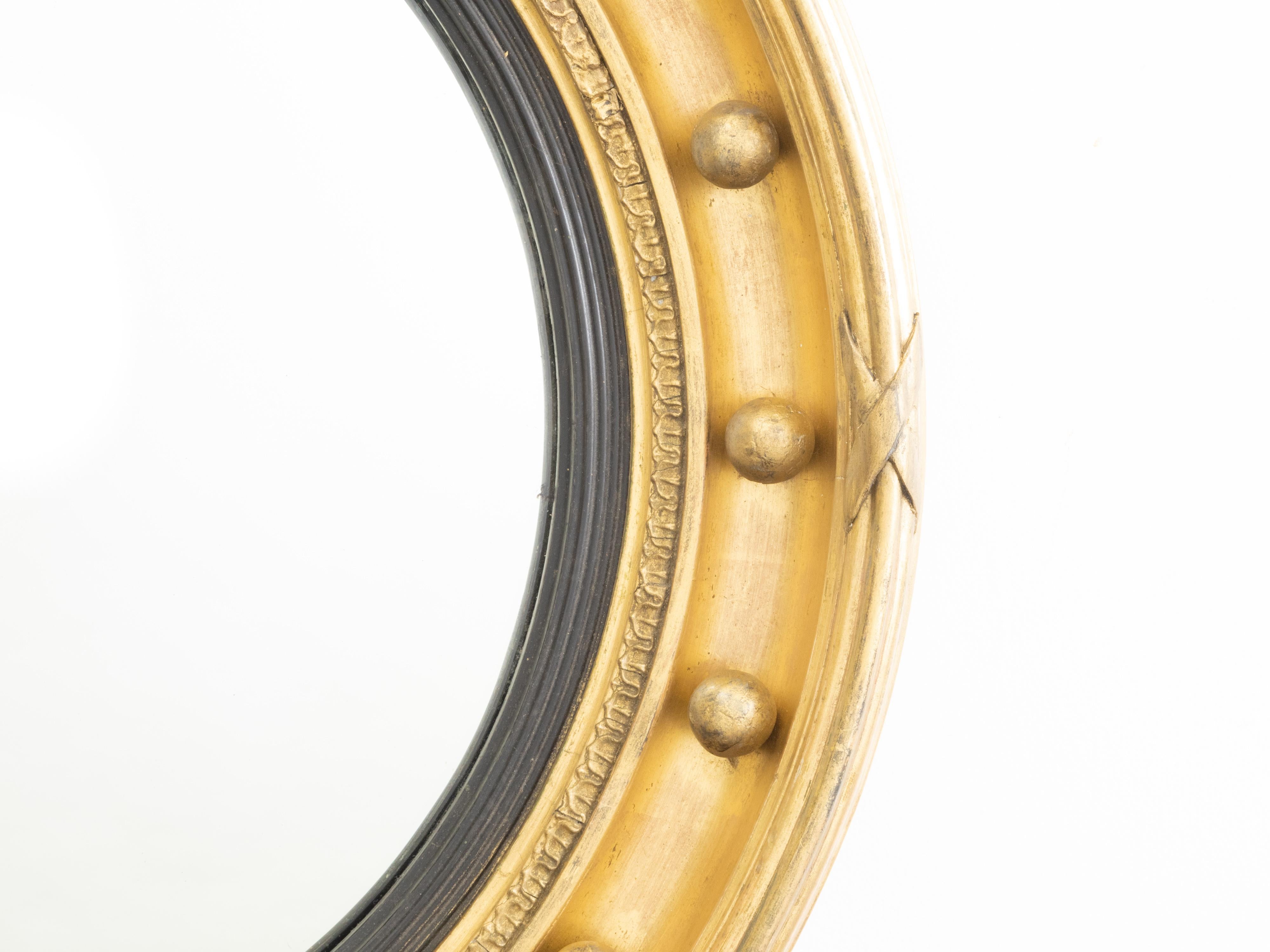 Kleiner englischer Bull's-Eye-Spiegel aus vergoldetem und ebonisiertem Holz des 19. 1
