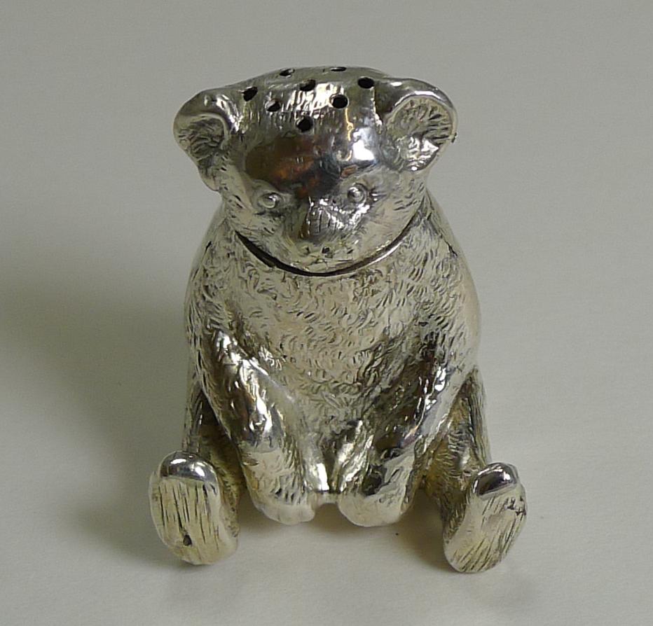 Always highly sought-after when they come along, these little teddy bear pepper pots are a charming addition to any English silver collection.

This little chap is fully hallmarked on the underside for Birmingham 1909 together with the makers mark