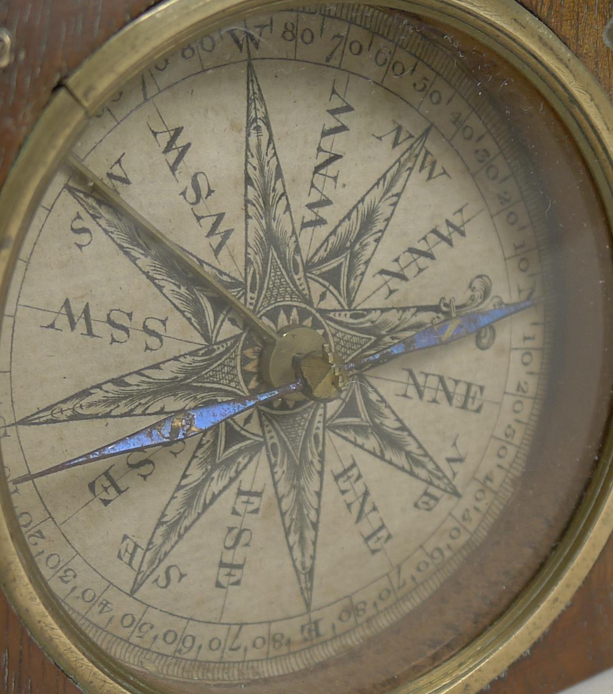 A very handsome Georgian compass dating to around 1800 set in a hinged mahogany block measuring 2