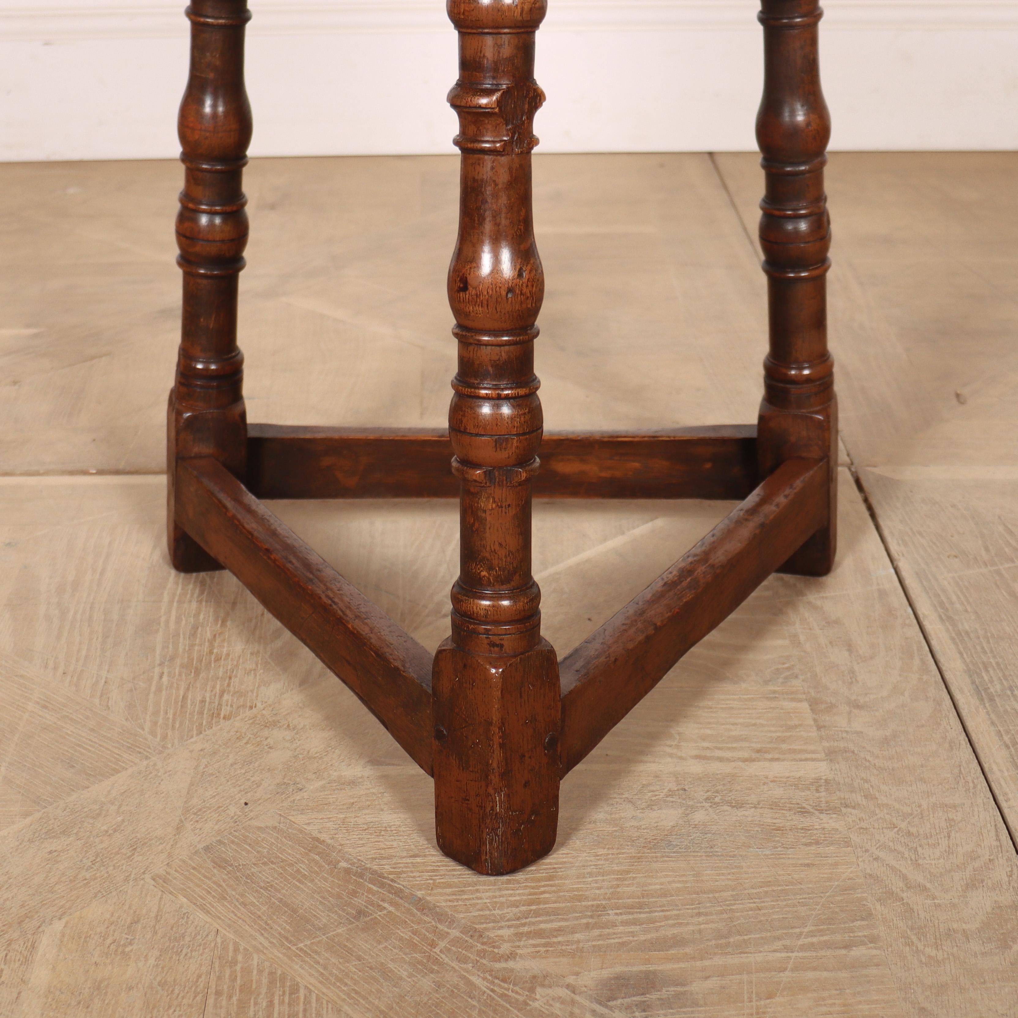 Small late 19th C English oak cricket table with good turned legs and traces of old brown paint. 1890.

Code: 8497

Dimensions:
H: 24
