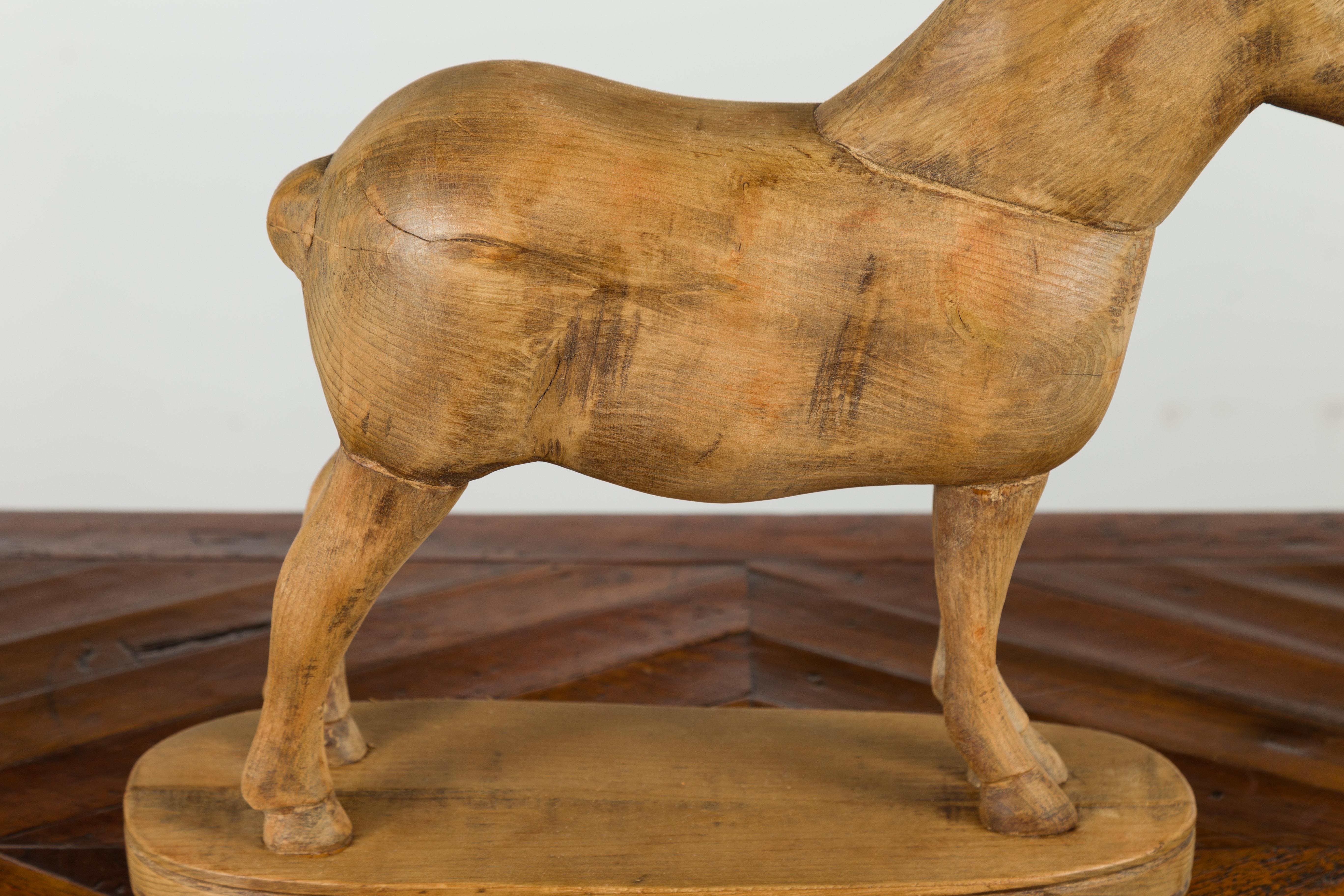 Small English Turn of the Century Carved Pine Horse on Oval Base In Good Condition For Sale In Atlanta, GA