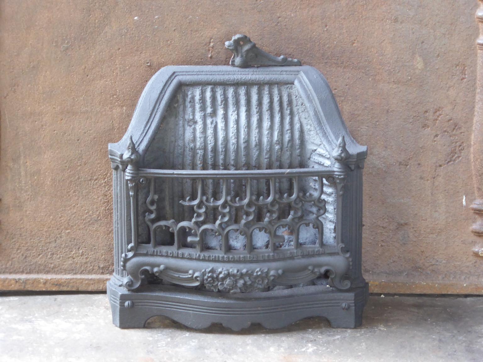 English Victorian style fireplace basket or fire basket. The fireplace grate is made of cast iron, wrought iron and a heat resistant stone. The total width of the front of the grate is 15.0 inch (38cm).

















  