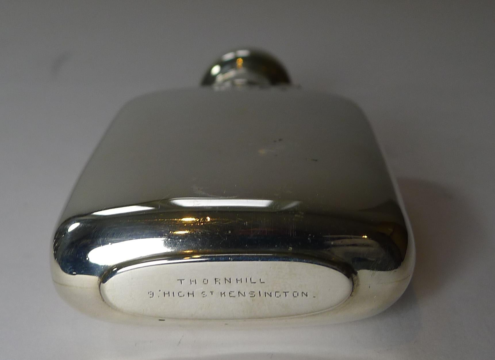 Petite in size, this small English hipflask is made from English sterling silver fully hallmarked for Birmingham 1897, a true Victorian example. The makers mark is also present for E O Marples.

The underside is also signed by the top notch