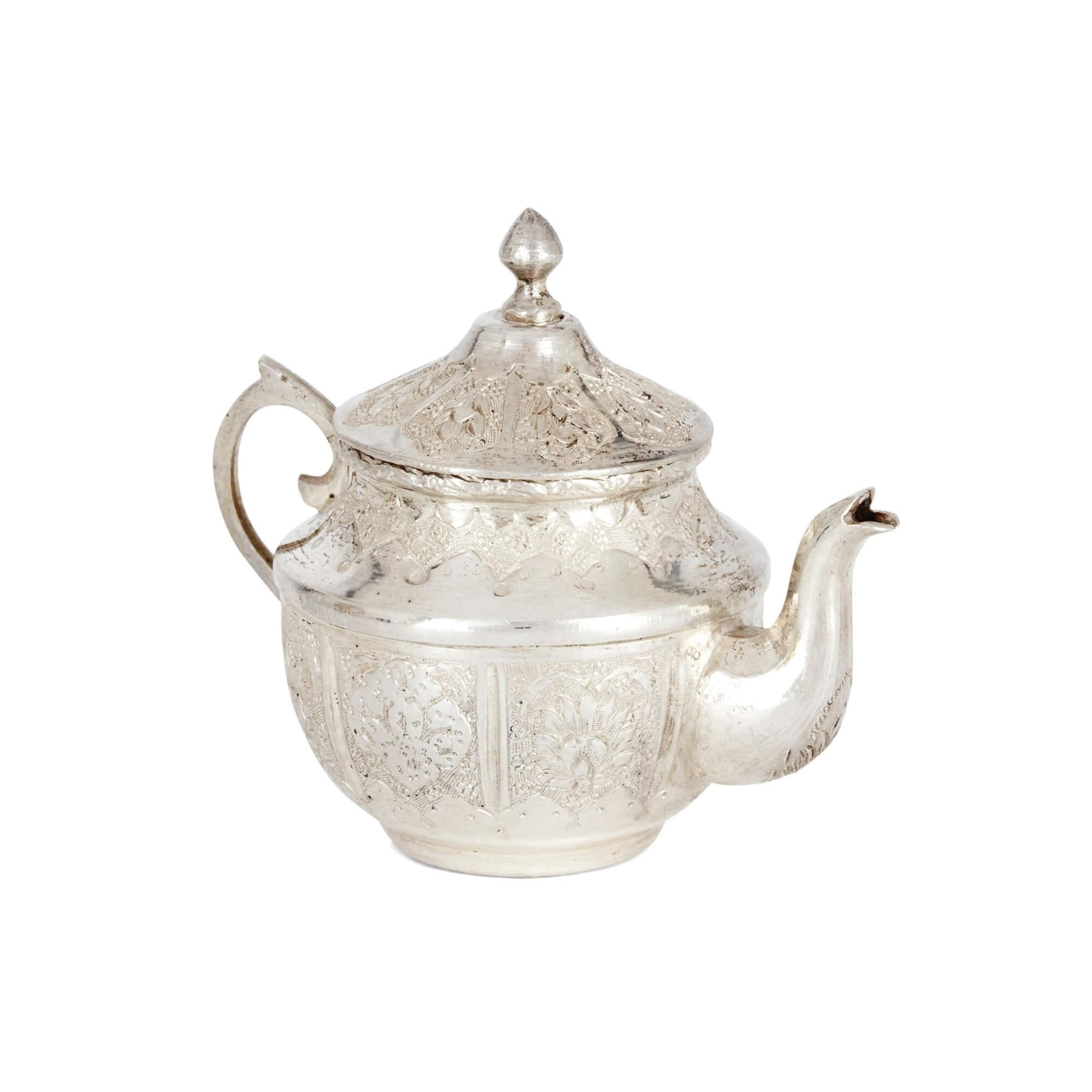 20th Century Small Engraved Silver Part-Tea Service of Persian Design For Sale